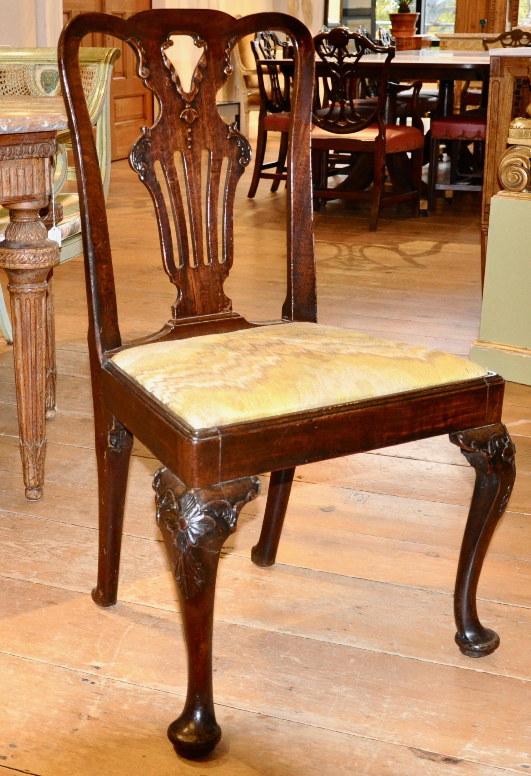 Set of six period English walnut George II side chairs

Six period Georgian side chairs in transitional form moving from Queen Anne to George II in design and age. Original finish. Great patina. Fine condition. Usable and stable and of modern size.