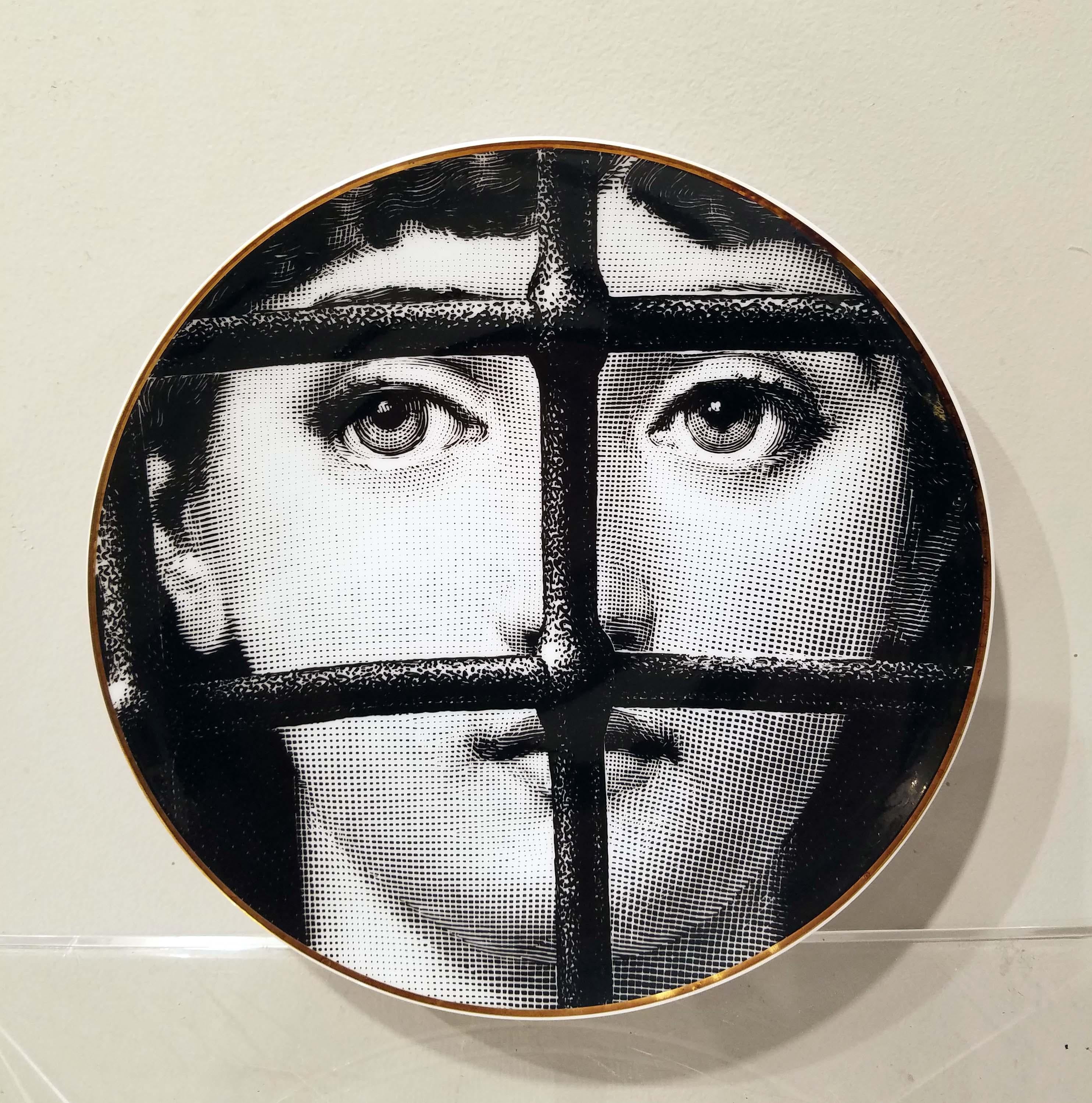 A large set of six displaying porcelain plates with surrealism designs by Piero Fornasetti for Rosenthal, an iconic series from 'Temi e variazioni' (“Themes and Variations”). Each with the original box included, circa 1980. These plates were made