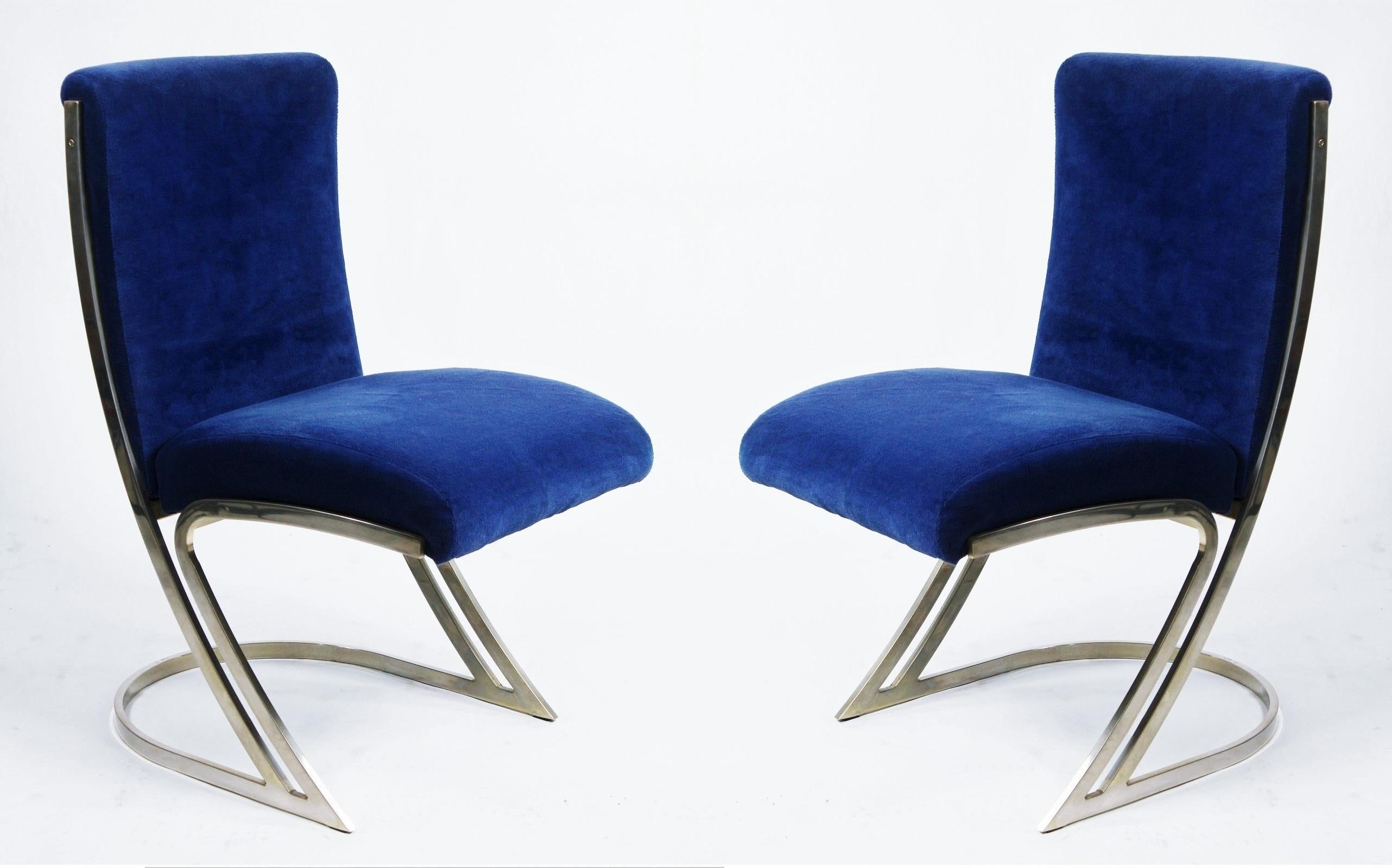 A stunning set of six Mid-Century Modern/ Regency styled Pierre Cardin design, dining chairs. Featuring plush cushioned new blue velvet upholstery supported by a sculptural cantilevered 
