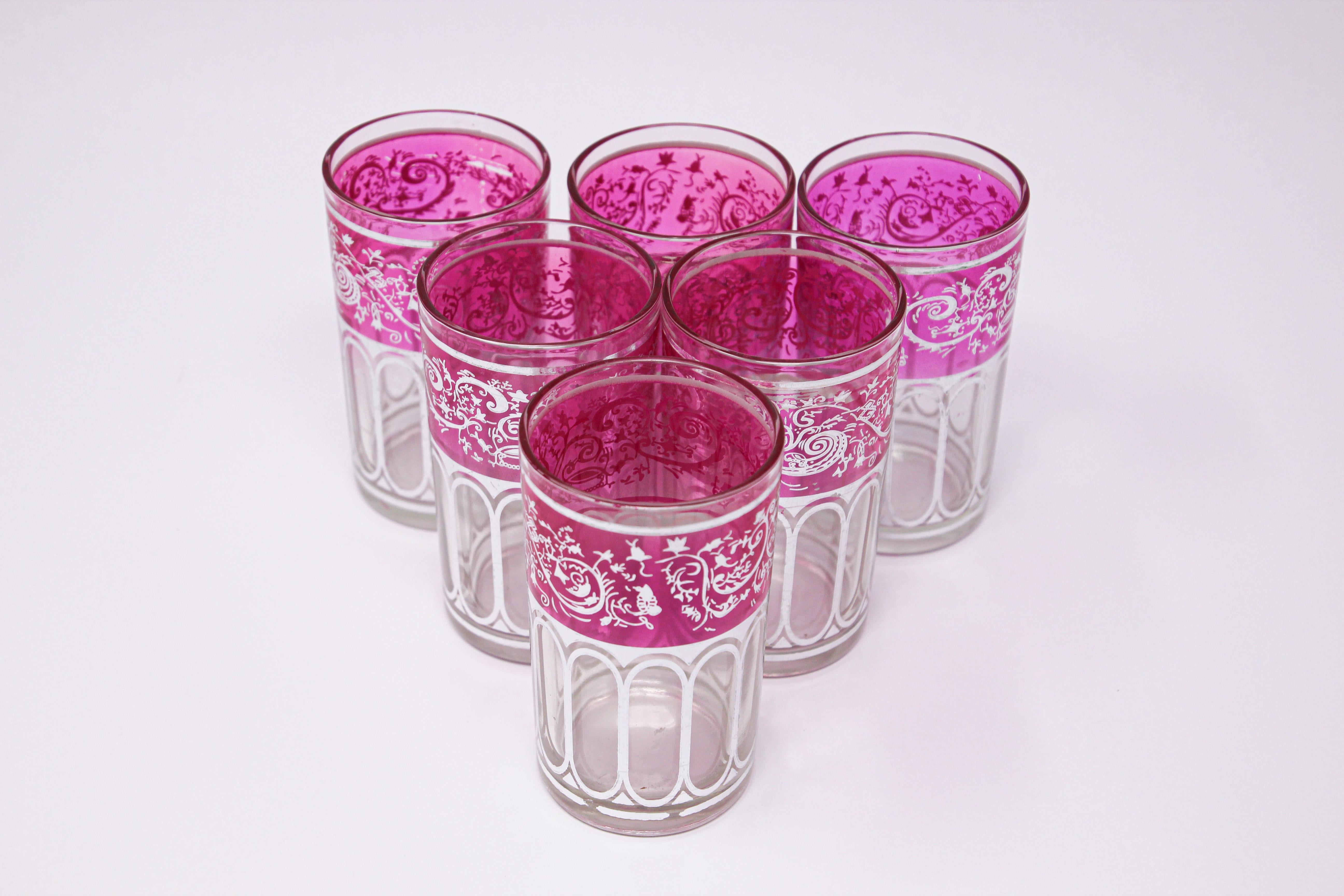 Set of six shot colored glasses with pink and silver raised Moorish design.
Decorated with a classical Moorish pattern frieze.
Use these elegant glasses for Moroccan tea, or any hot or shot cold drink.
In fantastic condition, perfect for the