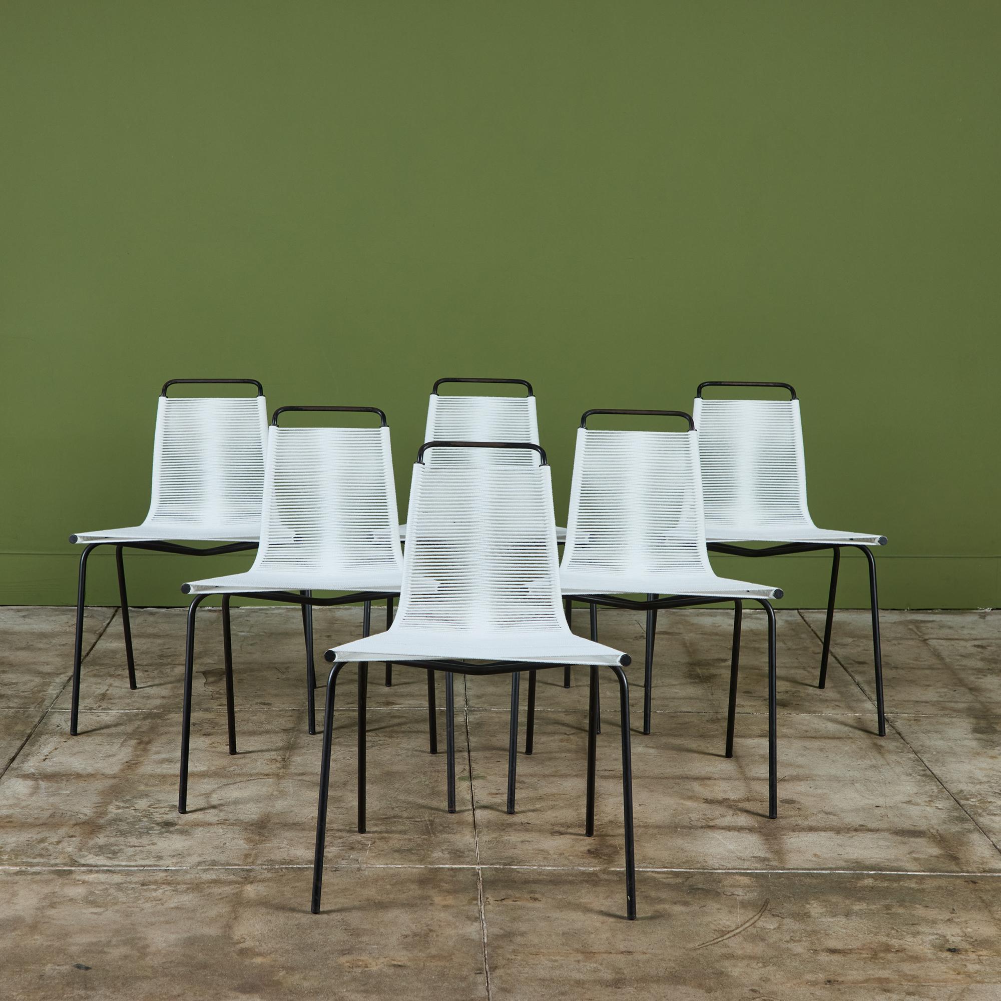 Set of six dining chairs designed by Poul Kjærholm for E. Kold Christensen in 1955. Originally, the series PK-1, -2, and -3 referenced a complete line of steel-frame chairs with the seat material indicated by the model number (1 is done in wicker, 2