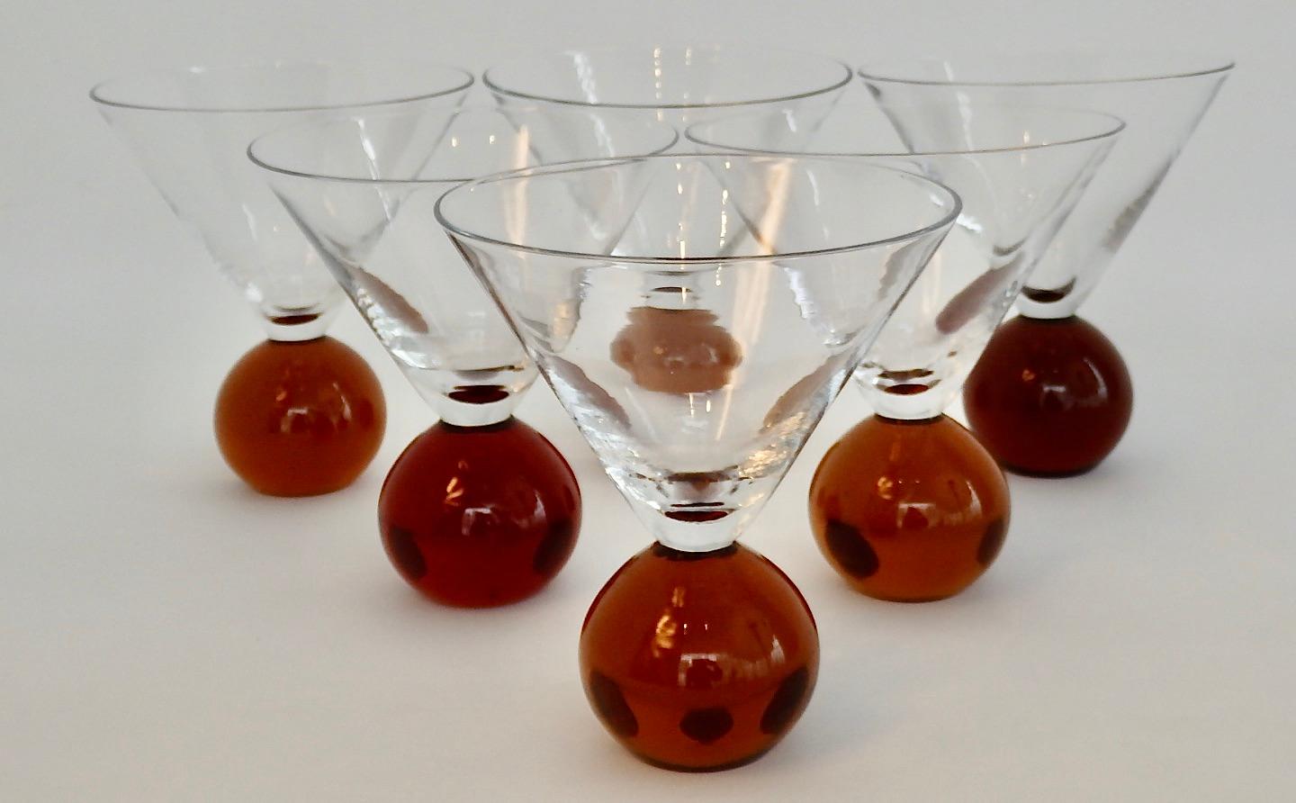 Six Postmodern Martini glasses. Amber ball base supports clear Martini style cocktail glass.