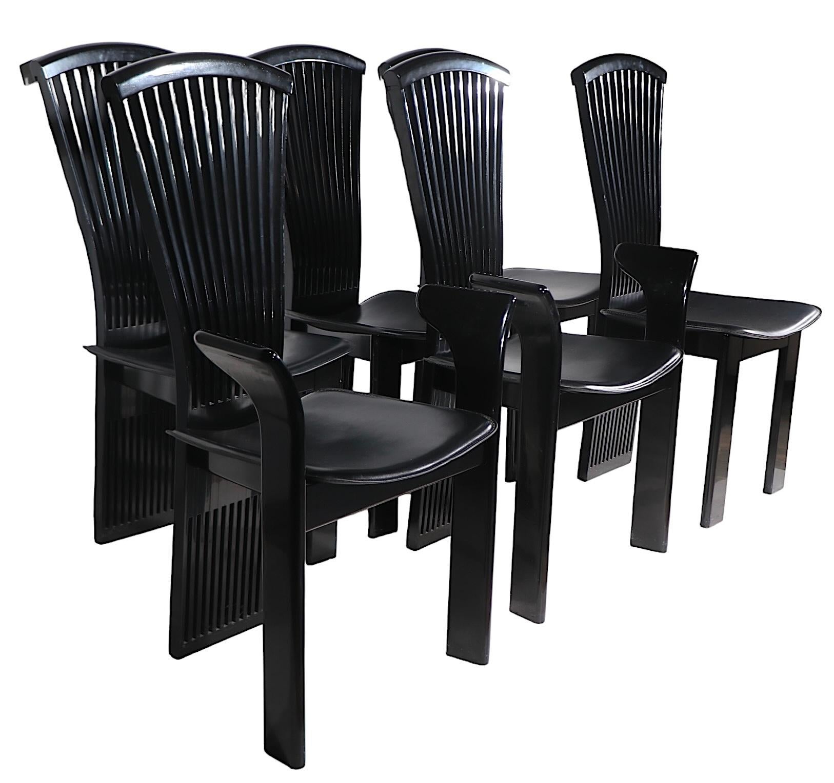 Heroic set of Post Modern, Hollywood Regency school  black lacquered  dining chairs made in Italy by Pieto Costantini, imported by Ello, circa 1970-1980's. The set consists of four side, and two arm chairs, having a dramatic slatted fan back which