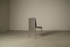 Set of six postmodernist stainless steel dining chairs from circa 1980-1990.