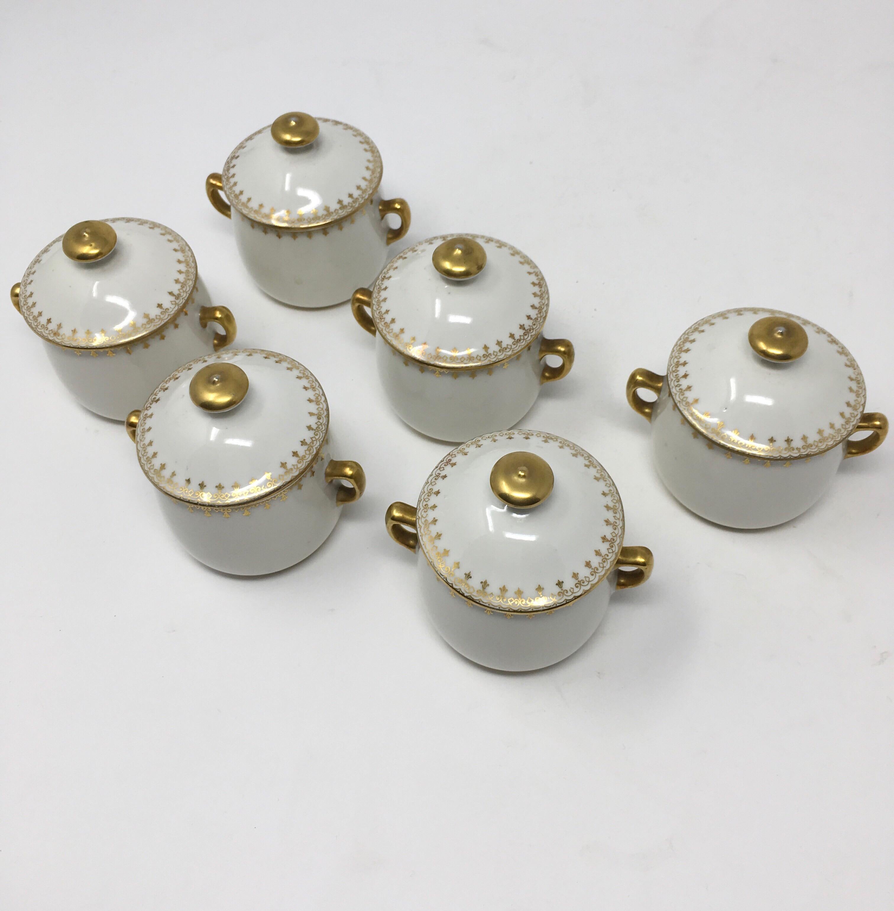 This is a set of six Limoges pots de crème, (cups of cream) with lids. These small cups were used to make and serve a dessert of cold custard. The small pots, (cups) with their own lids were used to protect the custard during baking. A beautiful set
