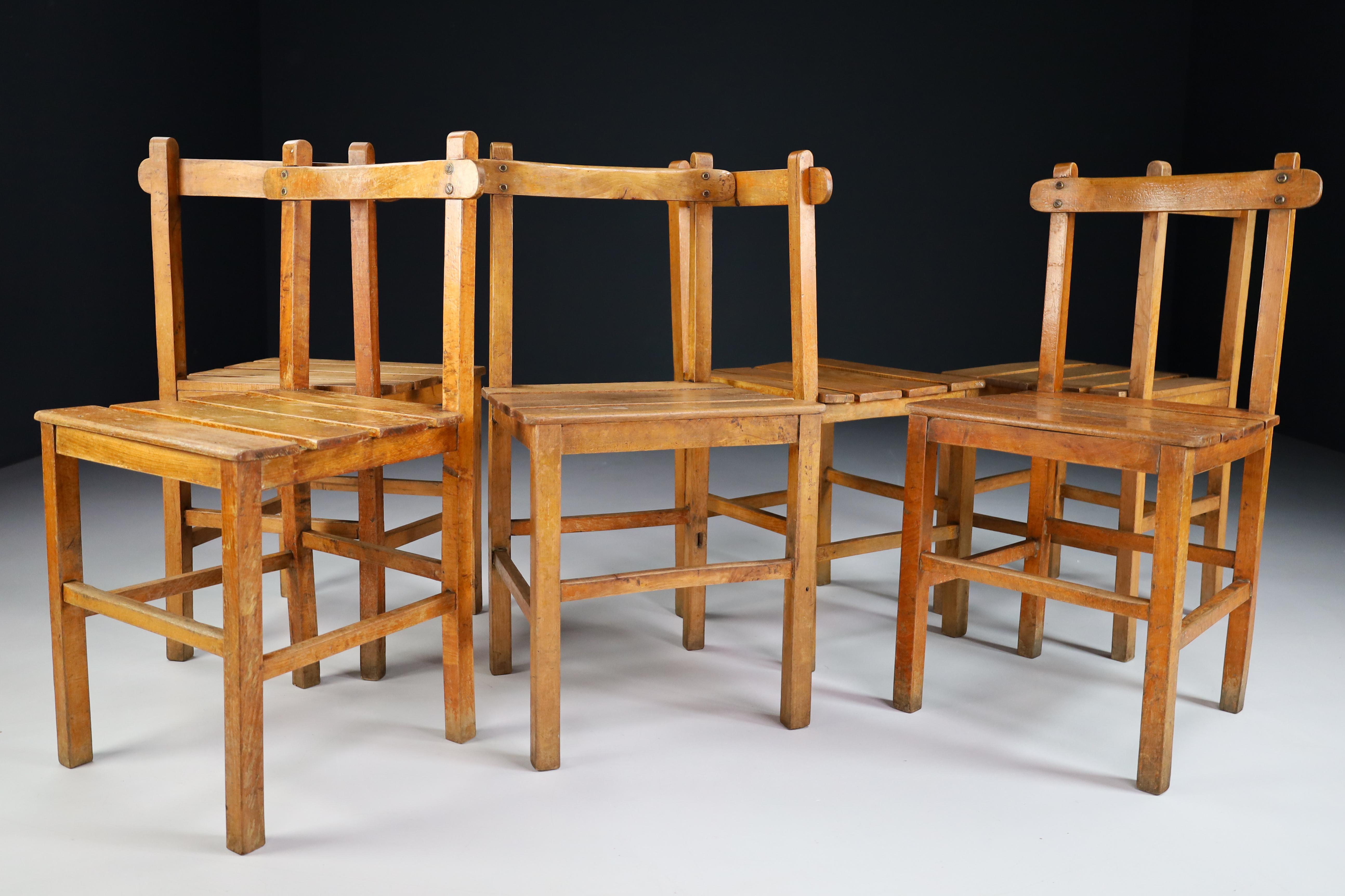 Set of six primitive chairs in solid beechwood, France 1950s. These chairs are in original and untouched condition, with amazing original patina. These chairs would make an eye-catching addition to any interior such as dining room, family room,