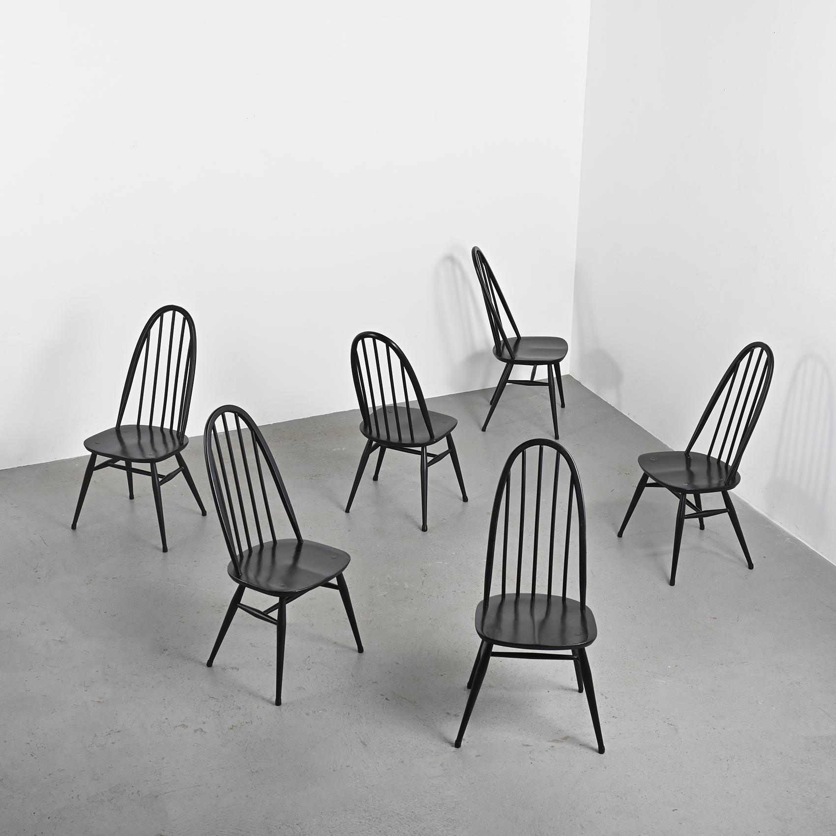 
Set of six Quaker chairs, designed by Lucian Ercolani for Ercol in the 1960s.

With their minimalist and functional design, these chairs feature a black lacquered wood structure and a spindle backrest, providing excellent support and comfort. Their