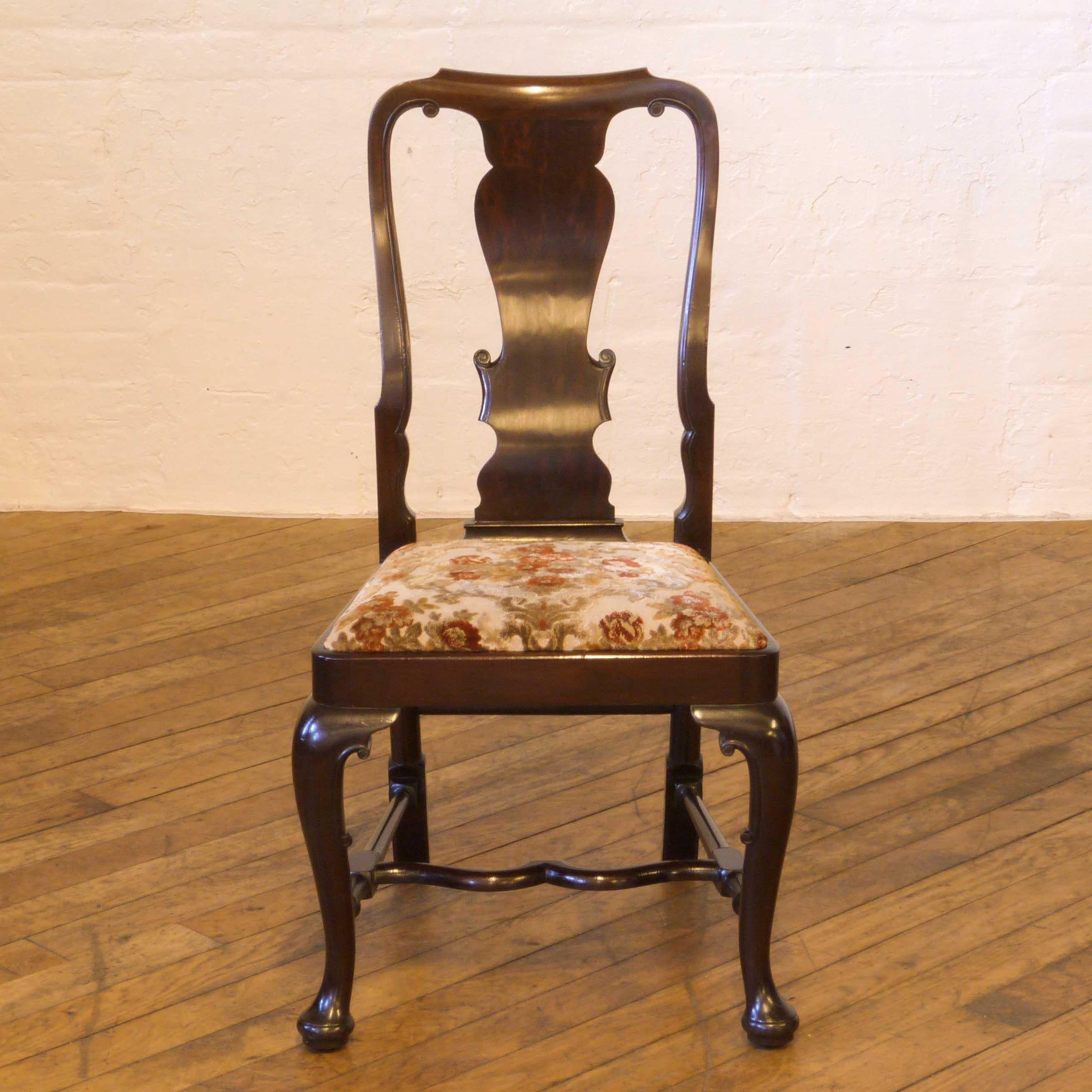 A high quality set of six mahogany chairs in the Queen Anne style. These are a heavy, solid chair with wonderfully shaped central stretchers. The drop in seats are easy to get recovered should you want to change the fabric although the existing