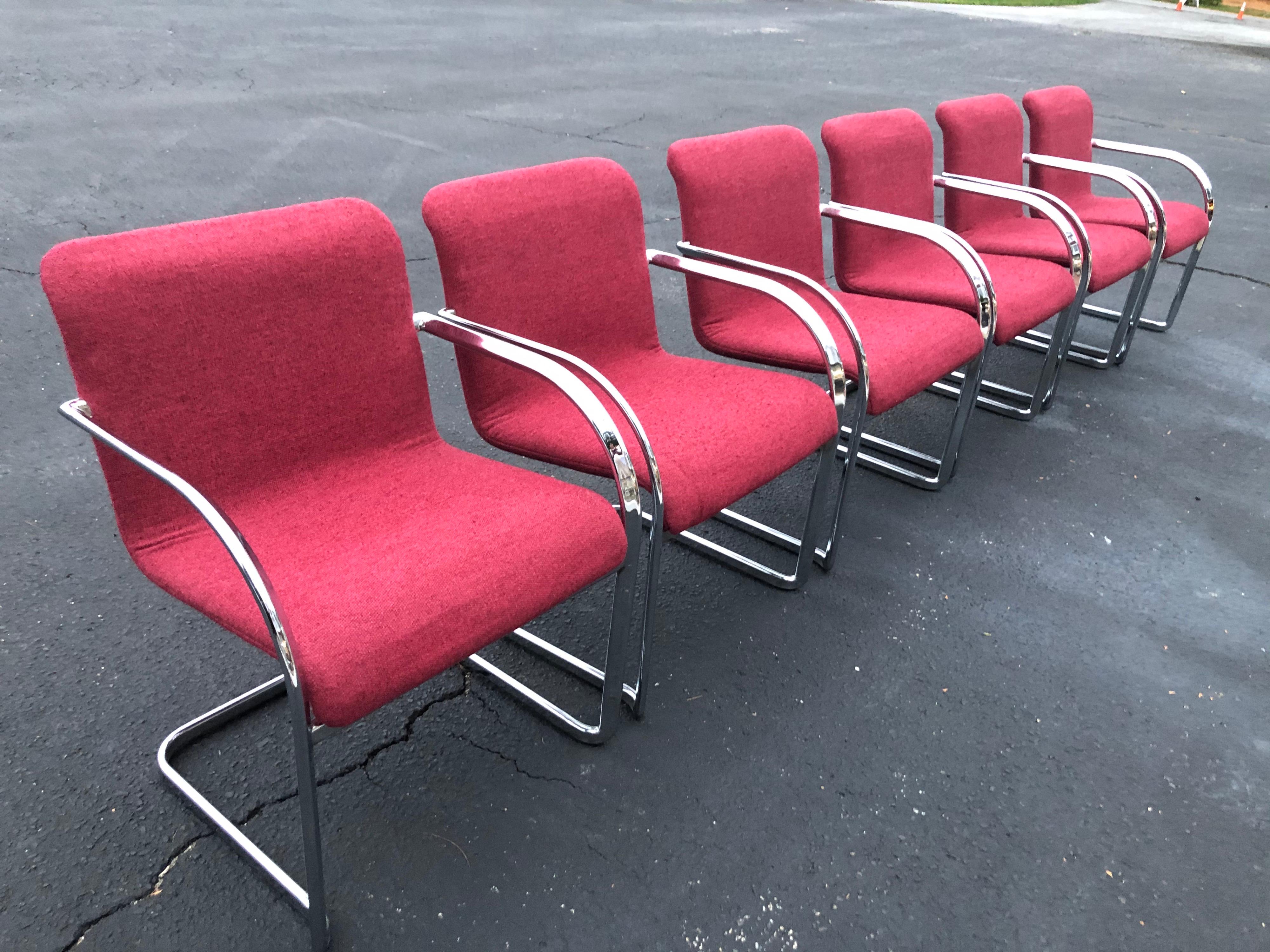 Set of six raspberry and chrome dining or office chairs. Heavy and solid construction make up these sexy 1970s style chairs. These cantilever chairs are in the style of Ludwig Mies van der Rohe. Chrome and upholstery are in very good condition.
