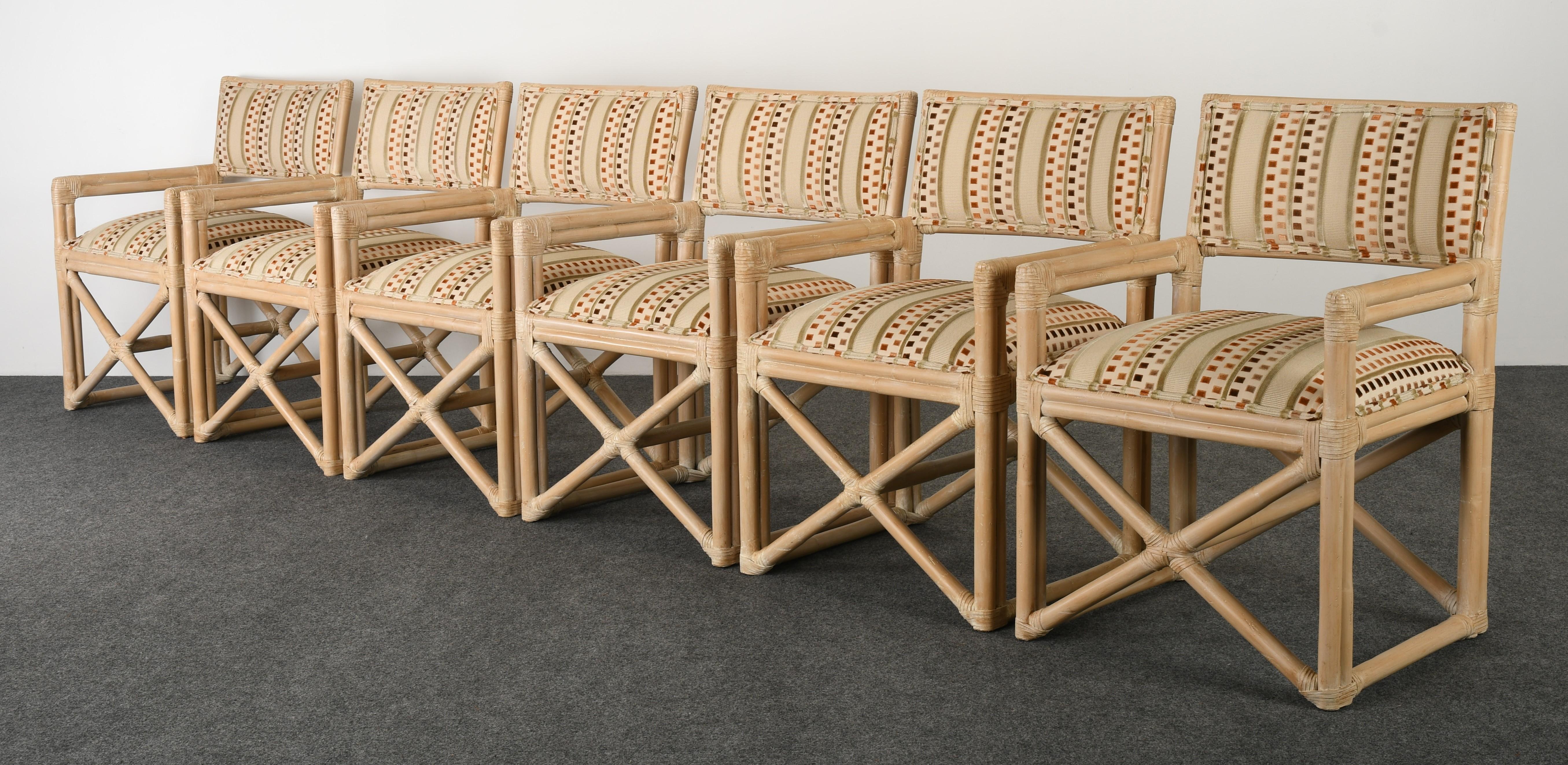 A natural organic set of six rattan dining chairs with silk and cut velvet fabric seats. The rattan is in very good condition with age-appropriate wear. The fabric seats can be used as found, however, there are a few small spots as shown in images.