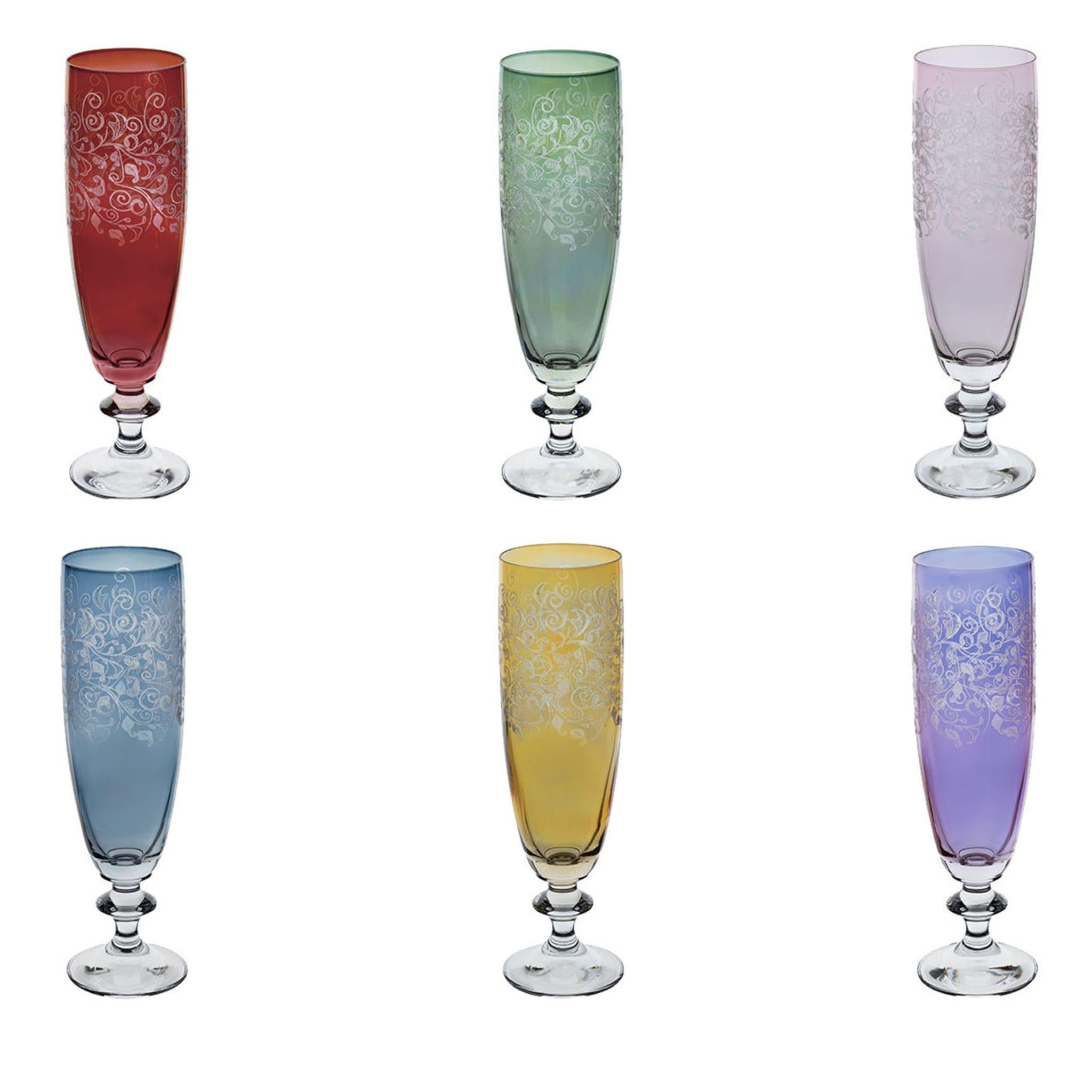 These six flutes are part of a set in the Ravel collection, which features mouth-blown glass pieces that are splendidly colored and etched with a floral motif that adds elegance and charm to each object. A precious addition to any cabinet bar or