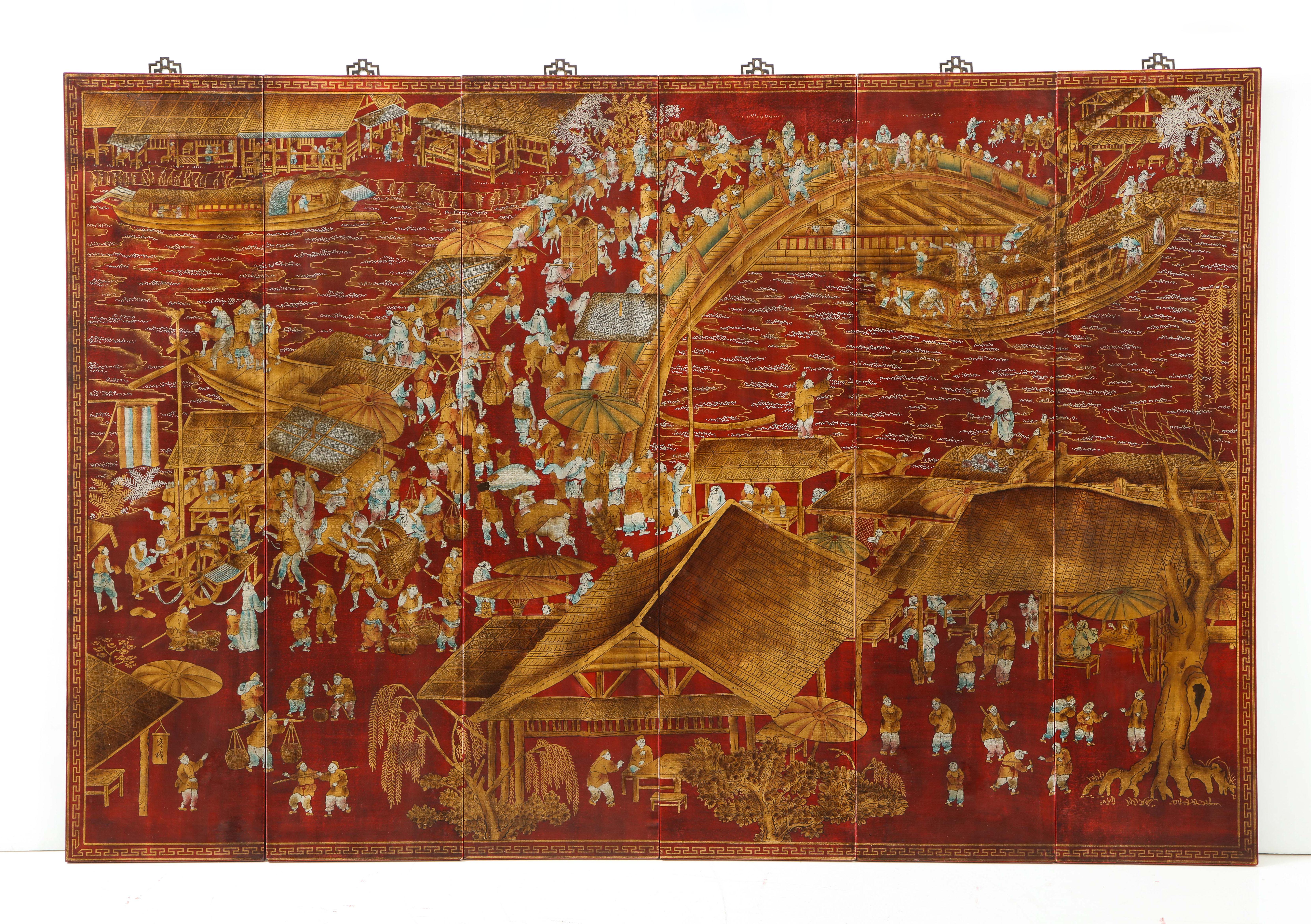 A set of six chinoiserie panels lacquered in a deep red with accents of gold and teal blue. This work of art depicts a lively scene and intricate detail. Each panel could stand on its own - but together, they make up story. These would be a great