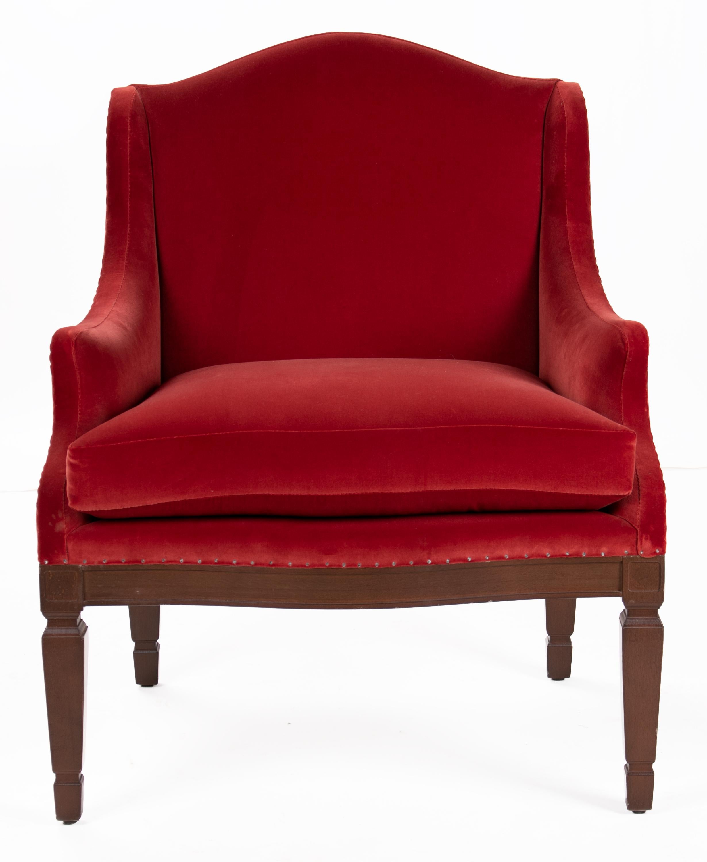 Set of six red upholstered wooden armchairs.