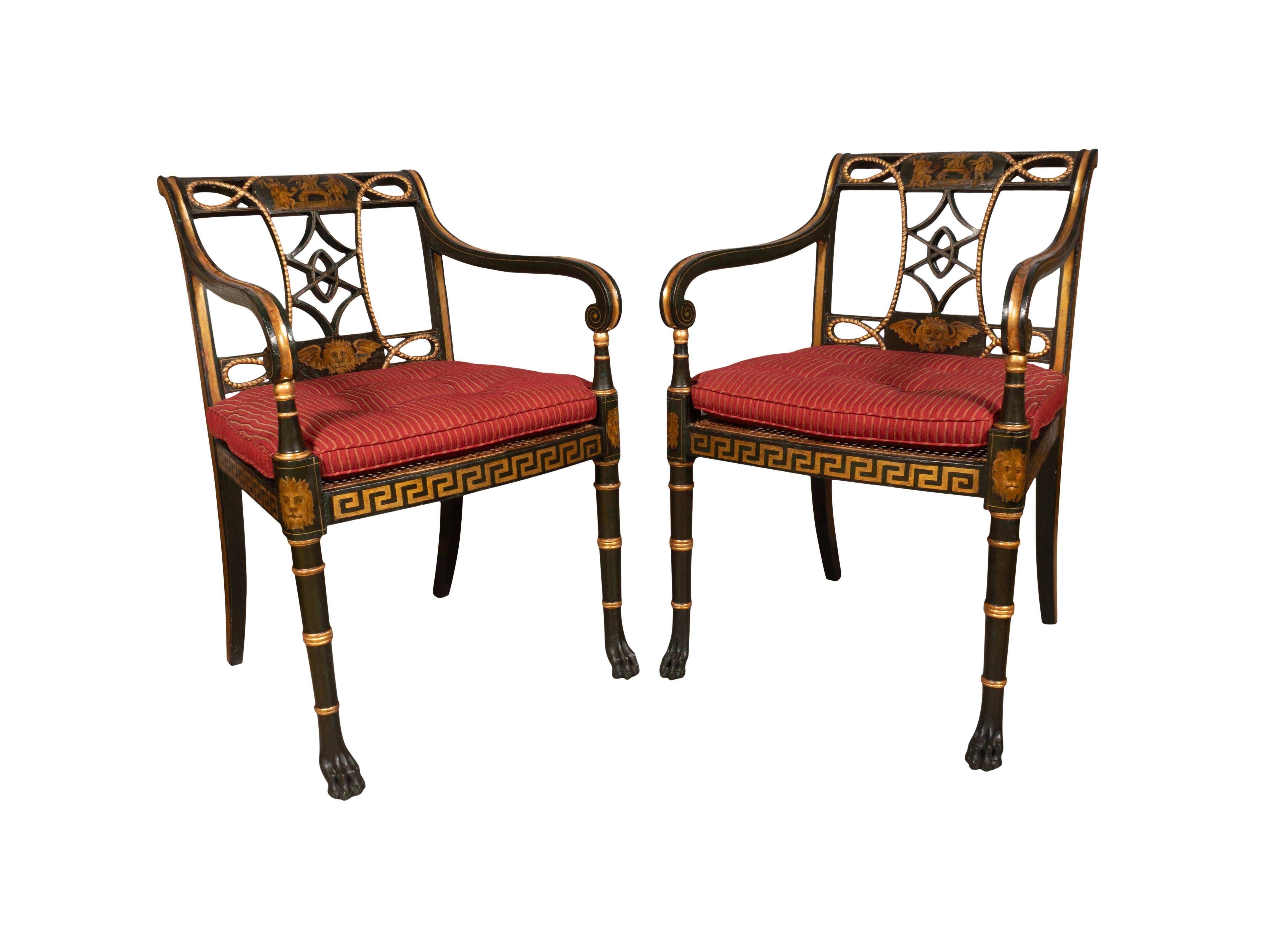 Each painted a dark green with gilt Greek key , winged lions heads , figures , chimera etc. Most likely by Gillow of Lancaster and London. Each with a painted crestrail over pierced splat and carved rope decoration. Caned seats with Greek key