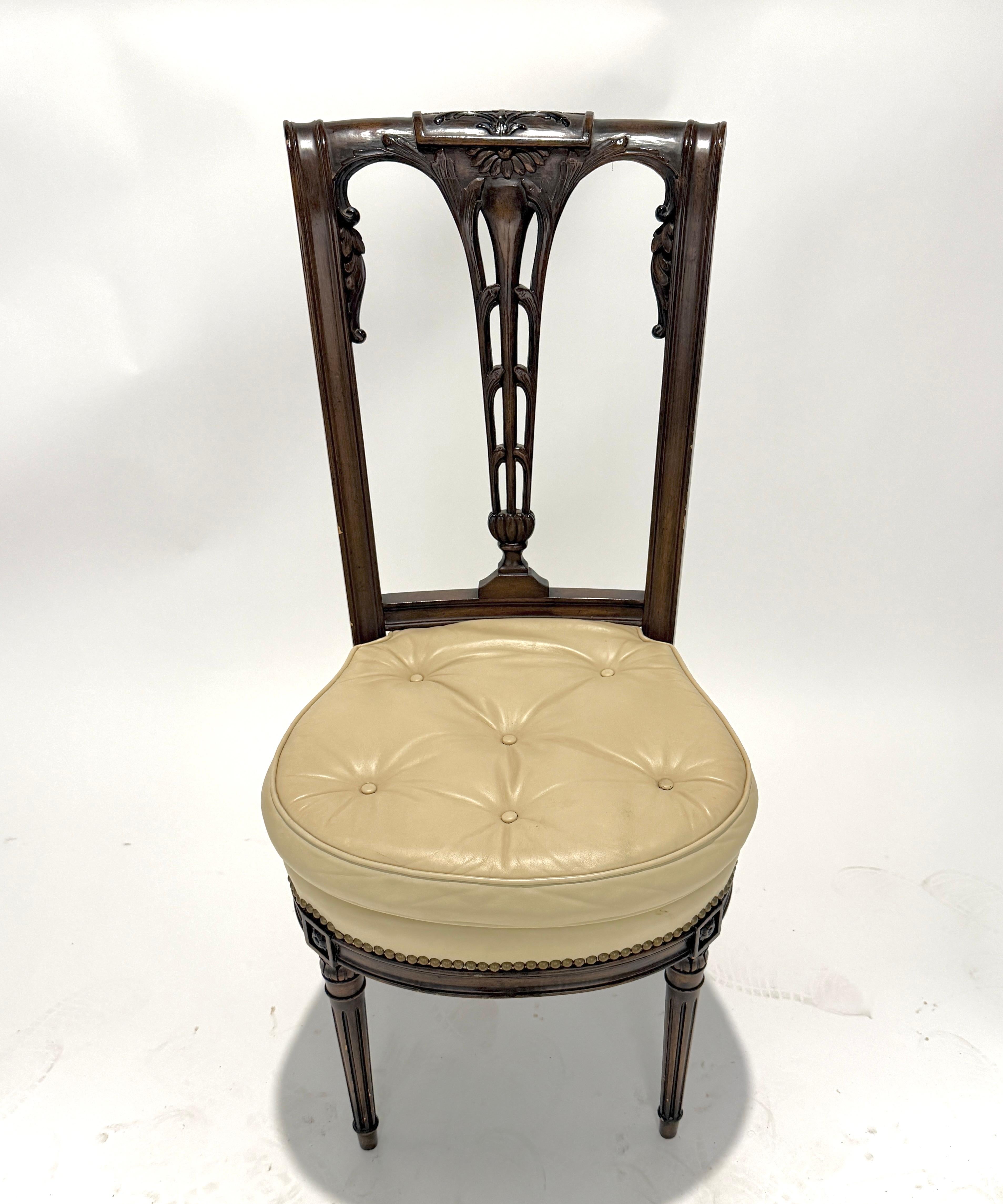 An exquisite set of six antique carved side chairs, showcasing refined craftsmanship and elegant detail. Each chair features a highly decorative pierced back with delicate openwork and floral carvings at the crest, all executed in rich, dark-stained
