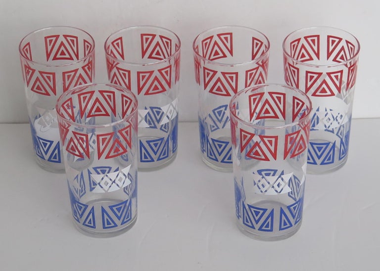 These are a good set of six Retro or Vintage glass tumblers or drinking glasses, with a red, white and blue geometric pattern, dating to the mid century modern period, circa 1950s

Each glass tumbler has a circular slightly tapered shape,