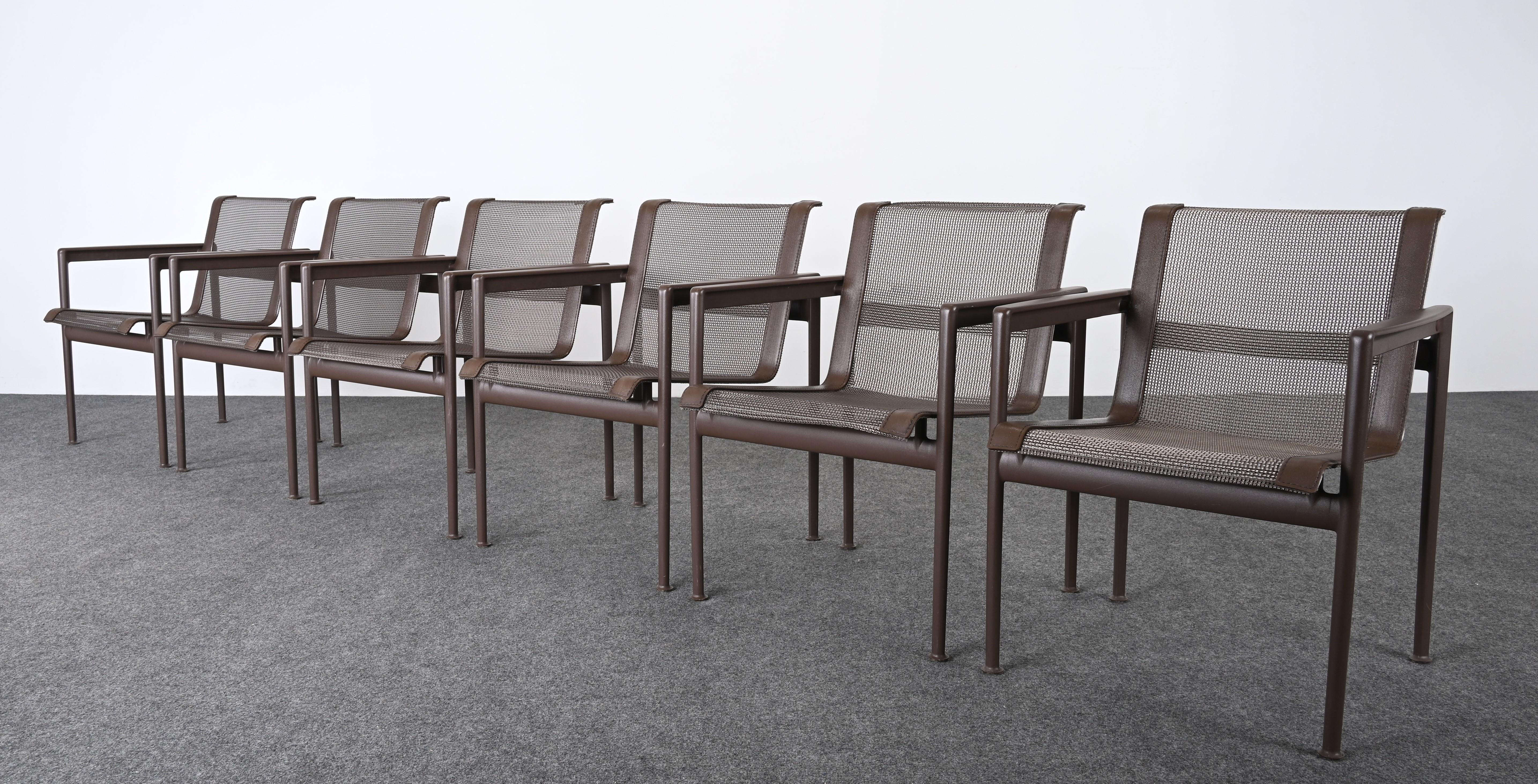 A functional and stylish set of six modern outdoor dining chairs designed by Richard Schultz for Knoll. These vintage dining chairs have a chestnut aluminum frame with mesh and leather seats. This classic design would work great in any outdoor patio