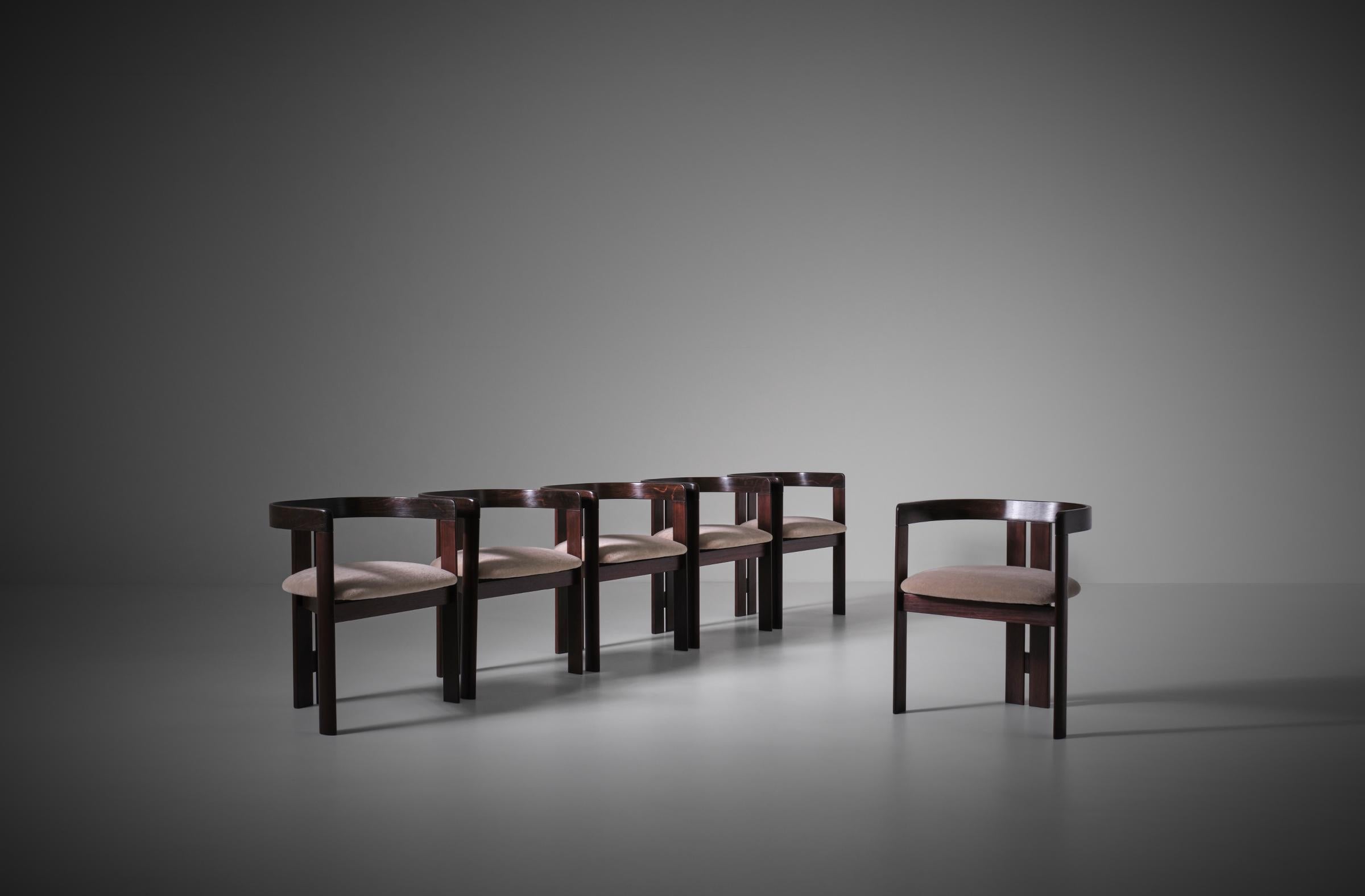 Set of six sculptural dining chairs, Italy 1960s. Beautiful design executed in Rosewood, very high quality and early production coming from an important villa in the North of Italy. The chairs have a strong sculptural design with beautiful details.