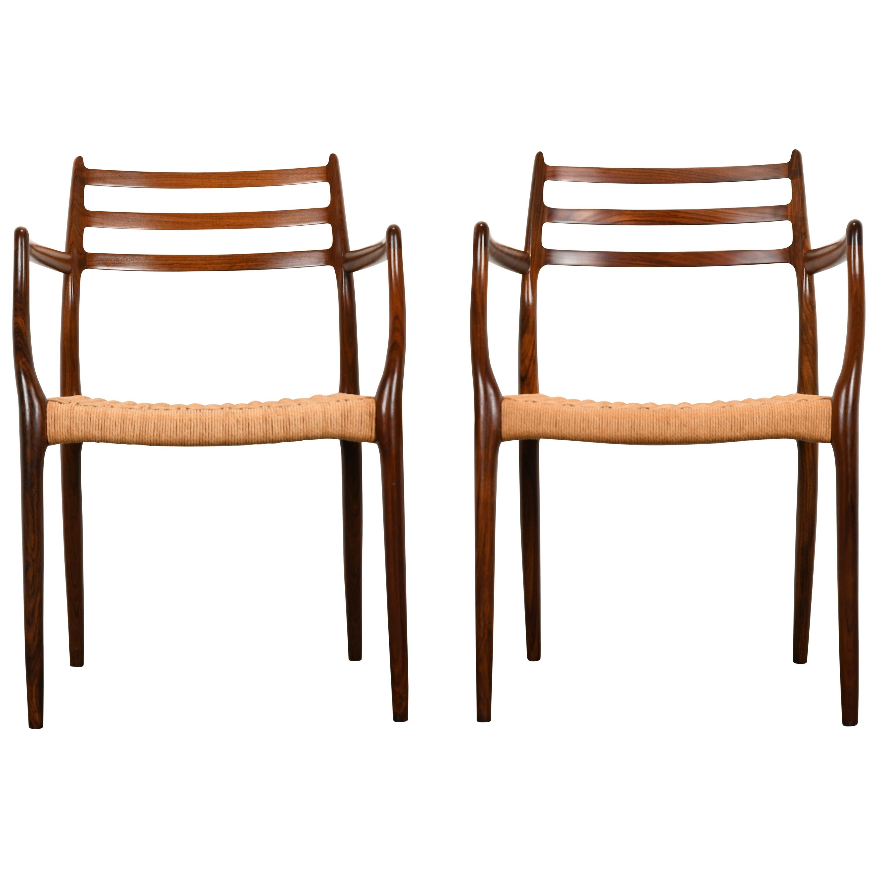 Set of six rosewood model 78 chairs by Niels O. Moller for J. L. Mollers upholstered in Papercord. There are two armchairs and four side chairs. Chairs are structurally sound with some minor wear as shown in images. Papercord seats are in good