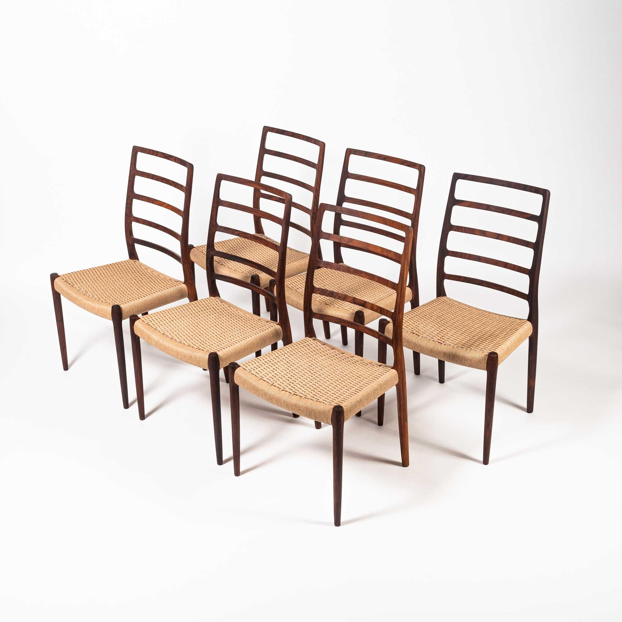 Rare and iconic set of 6 rosewood dining chairs designed by Niels Otto Moller for JL Møller Møbelfabrik in 1954. The set has been completely restored, with all new natural paper-cord. 