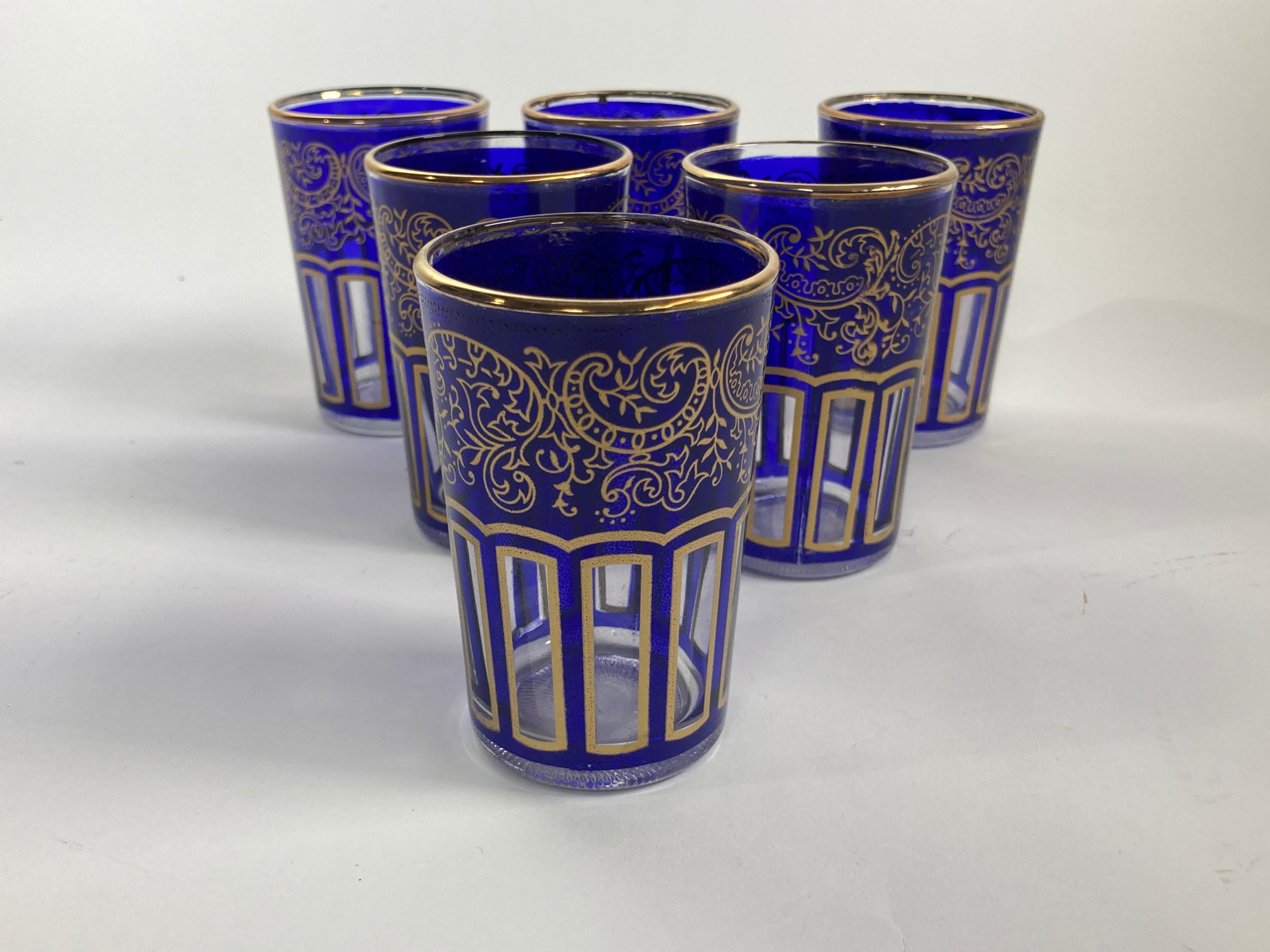 Moroccan Royal Blue Shot Glasses with Gold Moorish Design Set of 6.
Set of six royal cobalt blue shot drinking glasses barware with gold Moorish design.
These beautiful Moroccan drinking glasses are decorated with a classical arabesque gold pattern