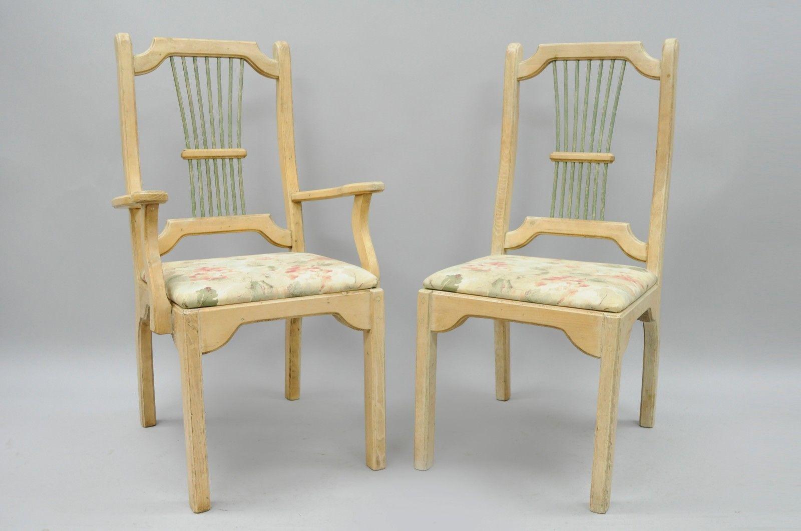 Set of six Charming Vintage Rustic French Country Style Solid Pine Spindle Back Dining Chairs. Item features two armchairs, four side chairs, unique exposed dowel joints throughout, solid wood construction, knotty wood grain, green painted spindles,