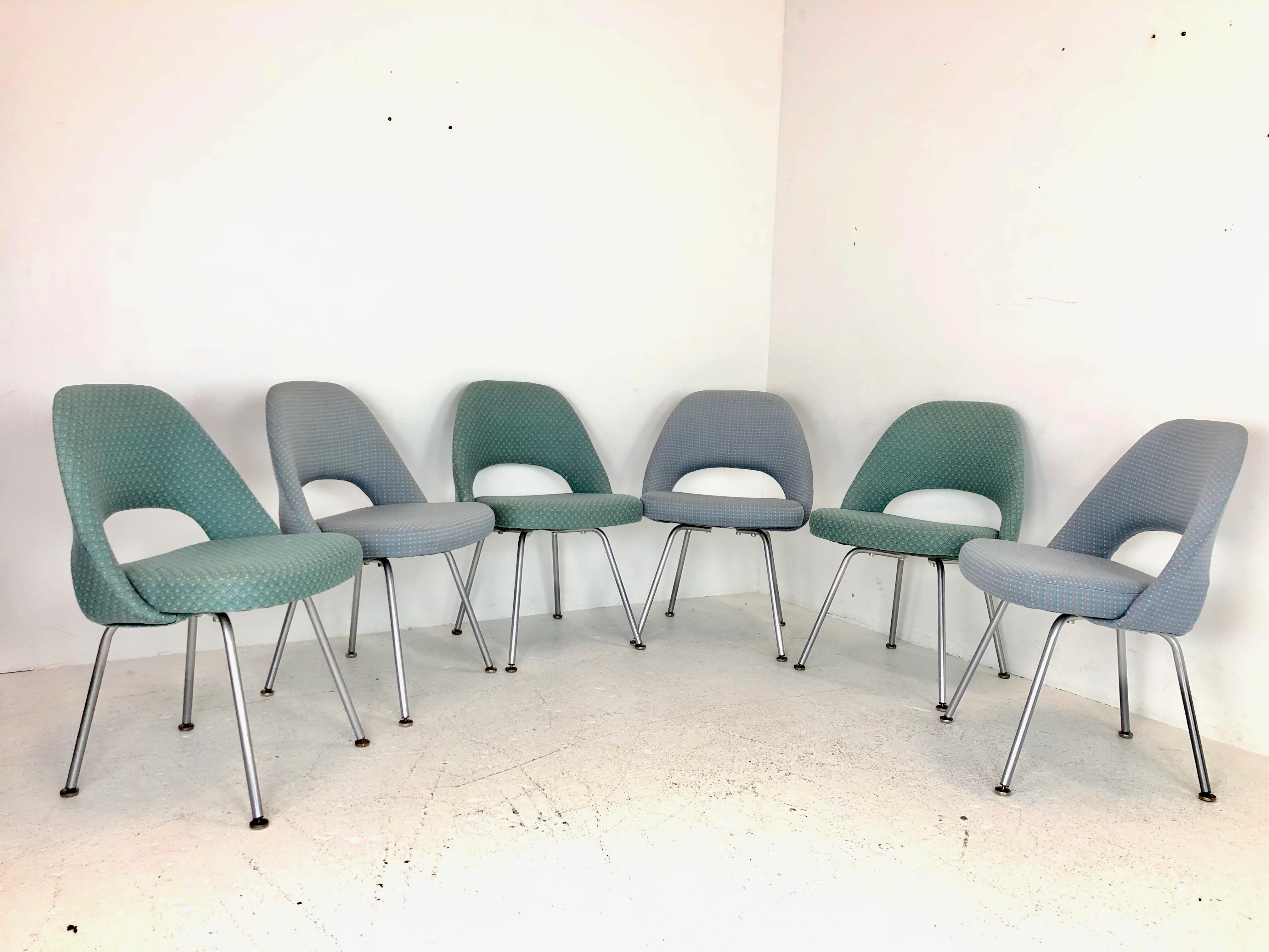 Set of six Saarinen executive chairs for Knoll. Chairs are upholstered in two different fabrics and recommend new upholstery.

Dimensions:
22 W x 20.5 D x 31 T
Seat height 19.