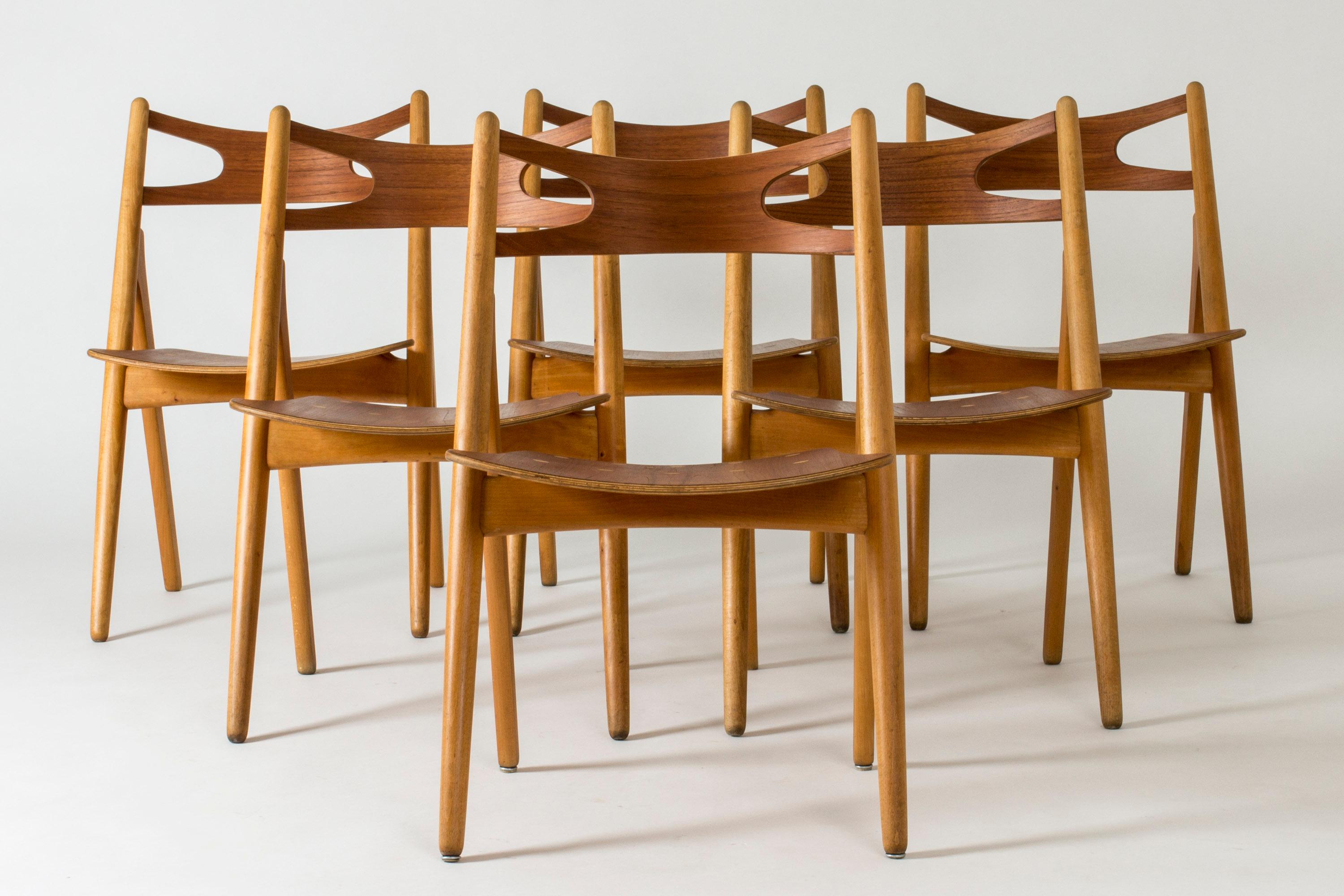 Set of six “Sawbuck” dining chairs by Hans J. Wegner, made from oak and teak. Decorative inlayed dots on the seats. Wonderful rustic design, great to sit on.