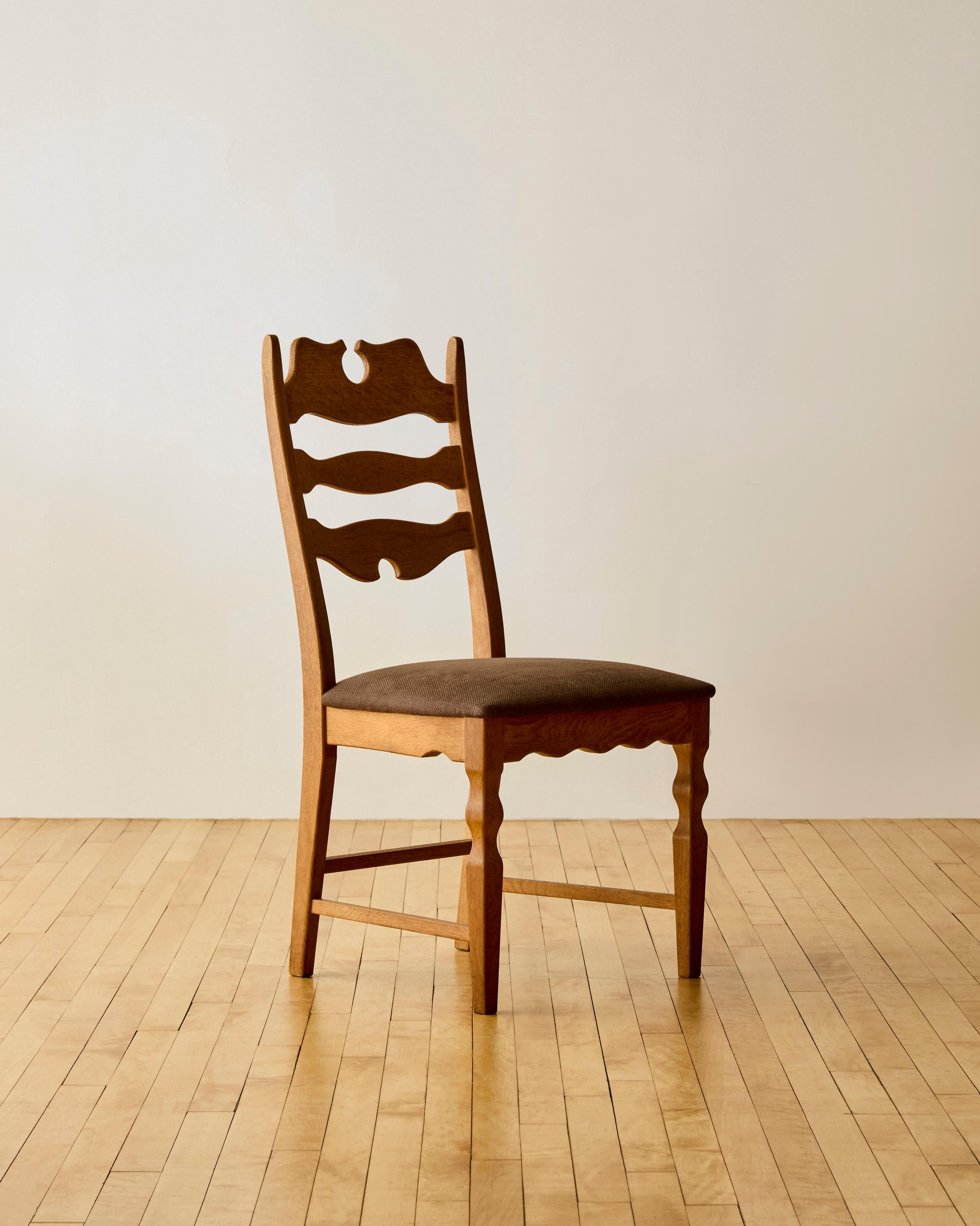 Set of six scalloped back Danish dining chairs by Henning Kjaernulf newly reupholstered in heavy chocolate brown linen.