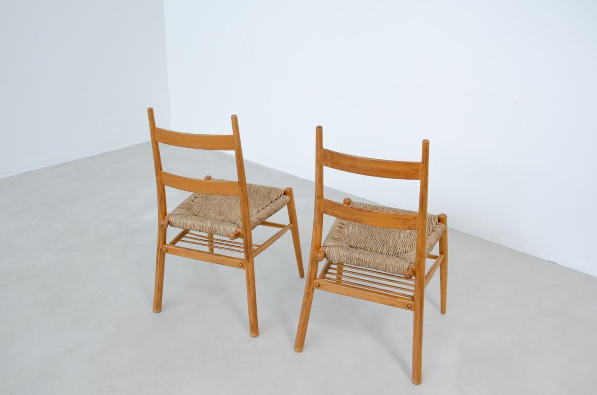 Classico americano Set di sei sedie scandinave in legno tornito con seduta in paglia. in vendita