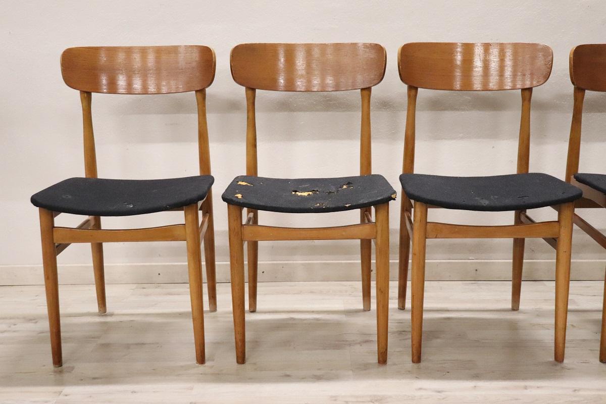 Scandinavian design lovely set of six dining room chairs, 1960s. The chairs are comfortable with a seat in sponge padding and black fabric covering. The structure is in beech wood. These chairs are perfect for the modern home. Used conditions,