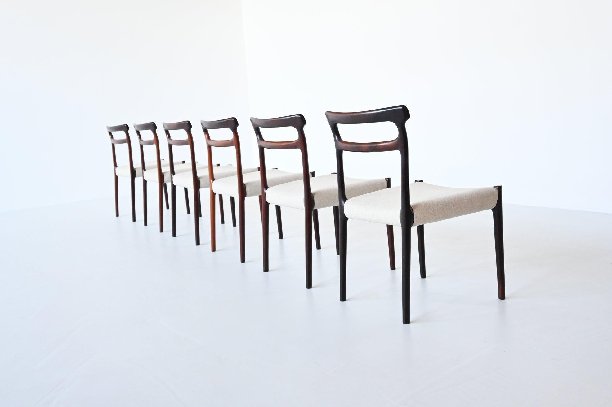 Beautiful shaped set of six dining chairs by unknown designer or manufacturer, Denmark 1960. These well-crafted chairs are made of nicely grained solid rosewood and the seats are newly upholstered with high quality Richwool fabric. They are in