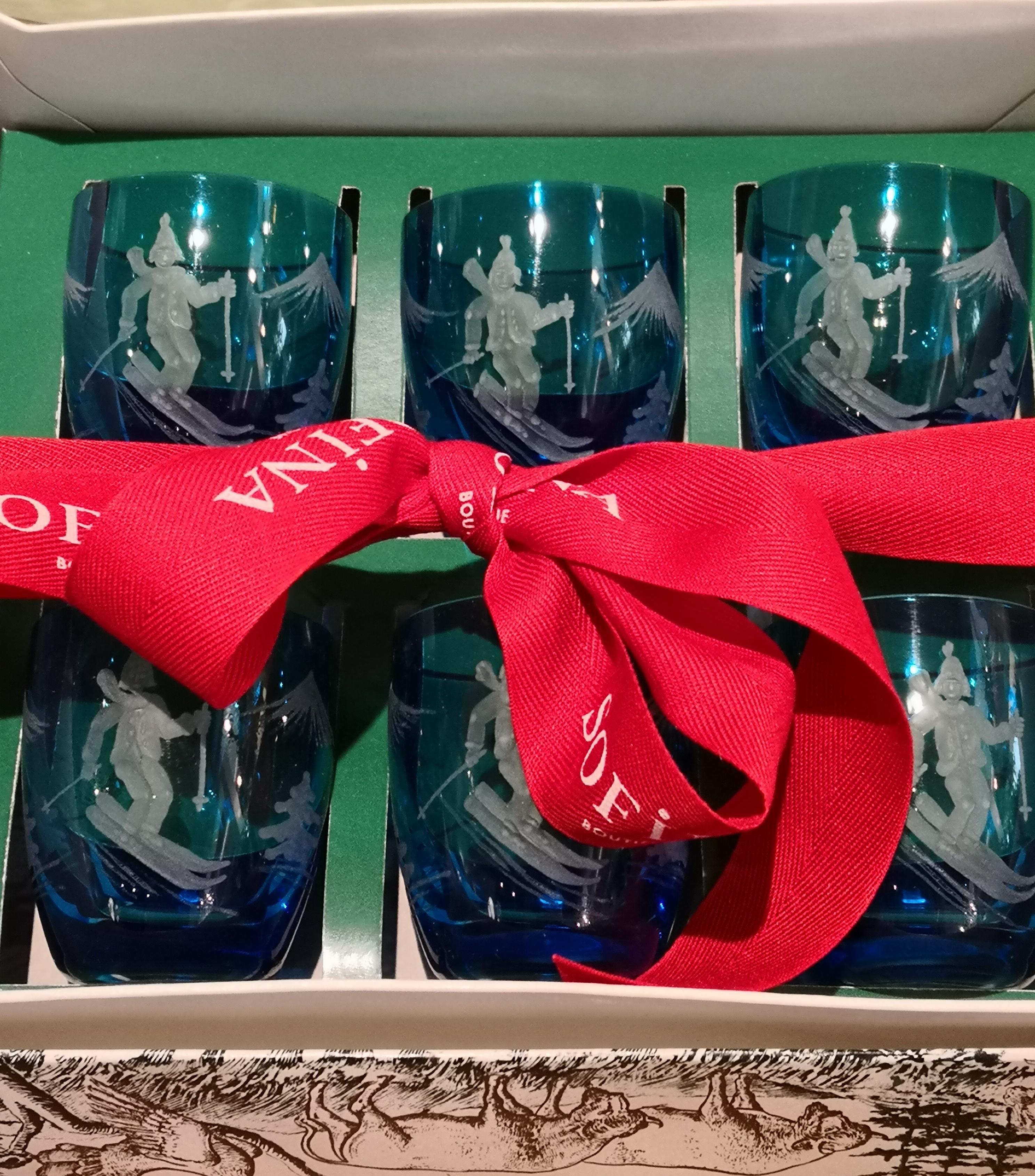 Set of six Schnapps glasses in blue crystal handmade in Bavaria. Hand blown crystal and hand-edged with a skiier and mountain decor in blue. The glasses can be ordered in different colors. Handmade by Sofina Boutique Kitzbuehel. Comes in a gift box.
