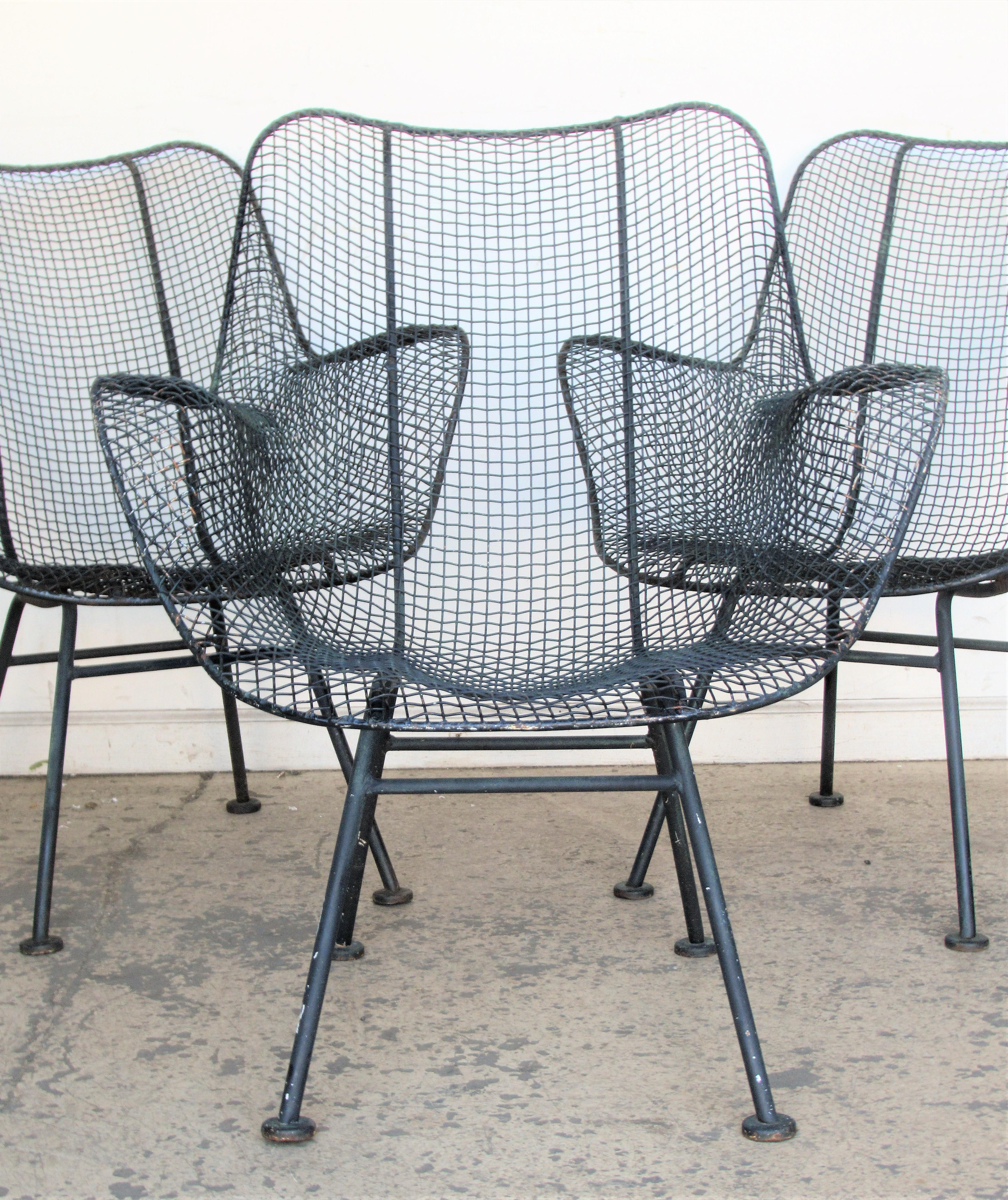 Set of six sculptura iron mesh patio garden lounge armchairs by Russell Woodard in beautifully aged old blackened surface, circa 1950. Great set. Look at all pictures and read condition report in comment section.