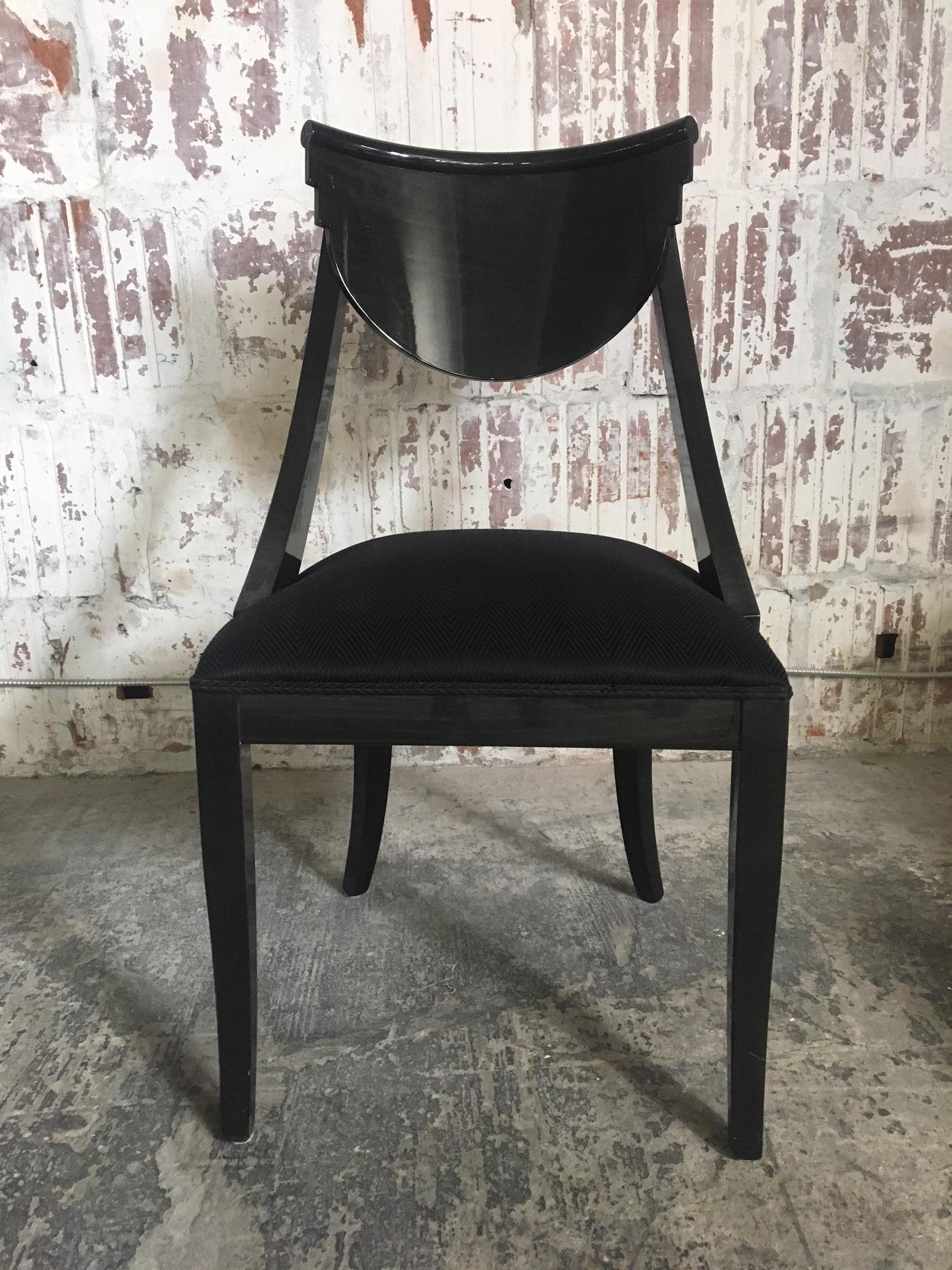 Set of six black lacquered dining chairs designed by Pietro Constantini for Ello Furniture, circa 1970s. Finish is a glossy deep black stain that allows a hint of wood grain to show through. Excellent vintage condition, both finish and upholstery.