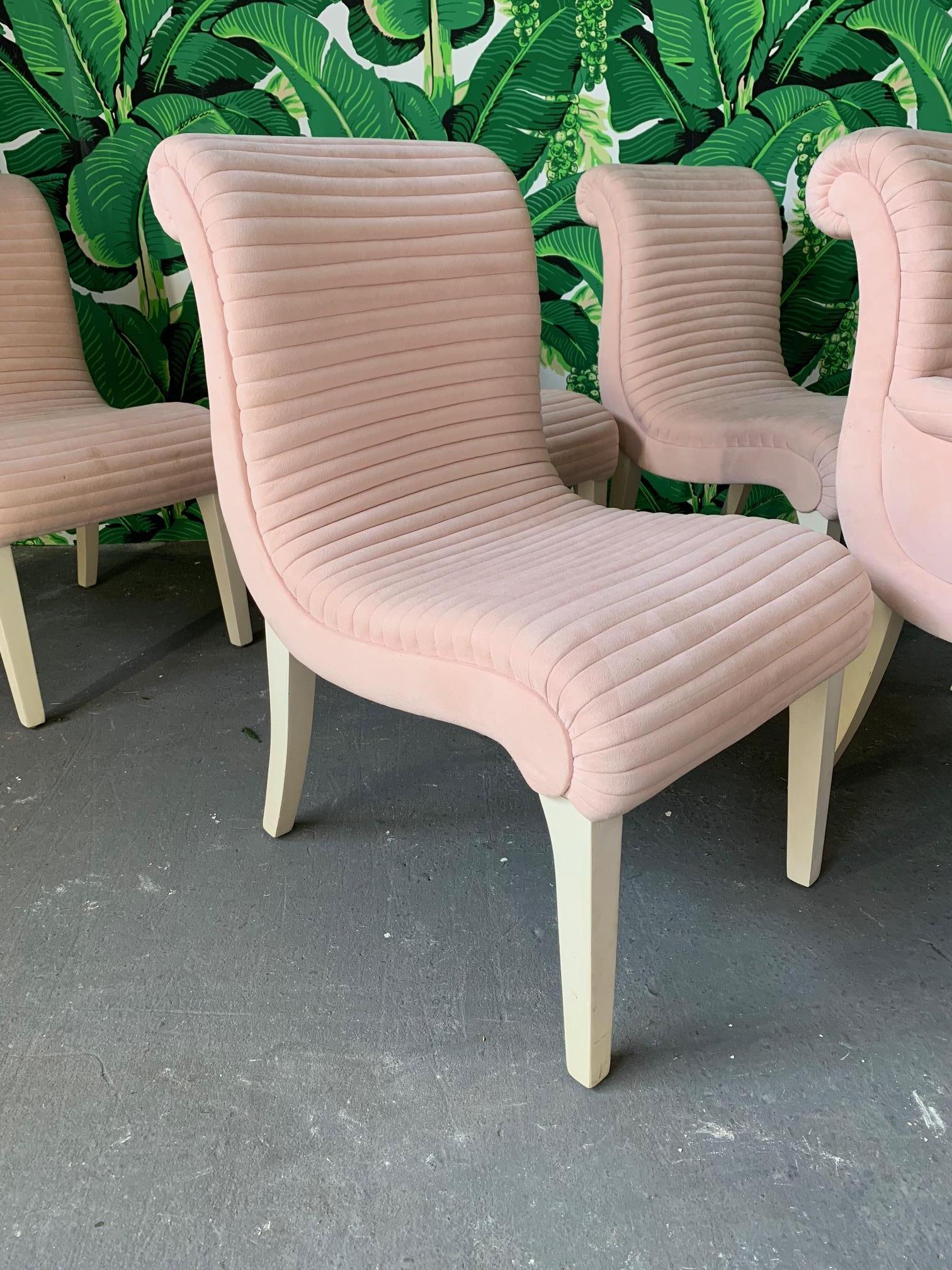 Set of 6 sculptural dining chairs by Preview Furniture Co. of Hickory, NC. Upholstered in a light pink fabric similar to suede. Velvety soft to the touch. Unique horizontal tufting and solid white legs. Chairs are heavy and structurally sound.
