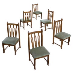Ensemble de six chaises de salle à manger sculpturales en Oak massif dans le style de Henning Kjærnulf 