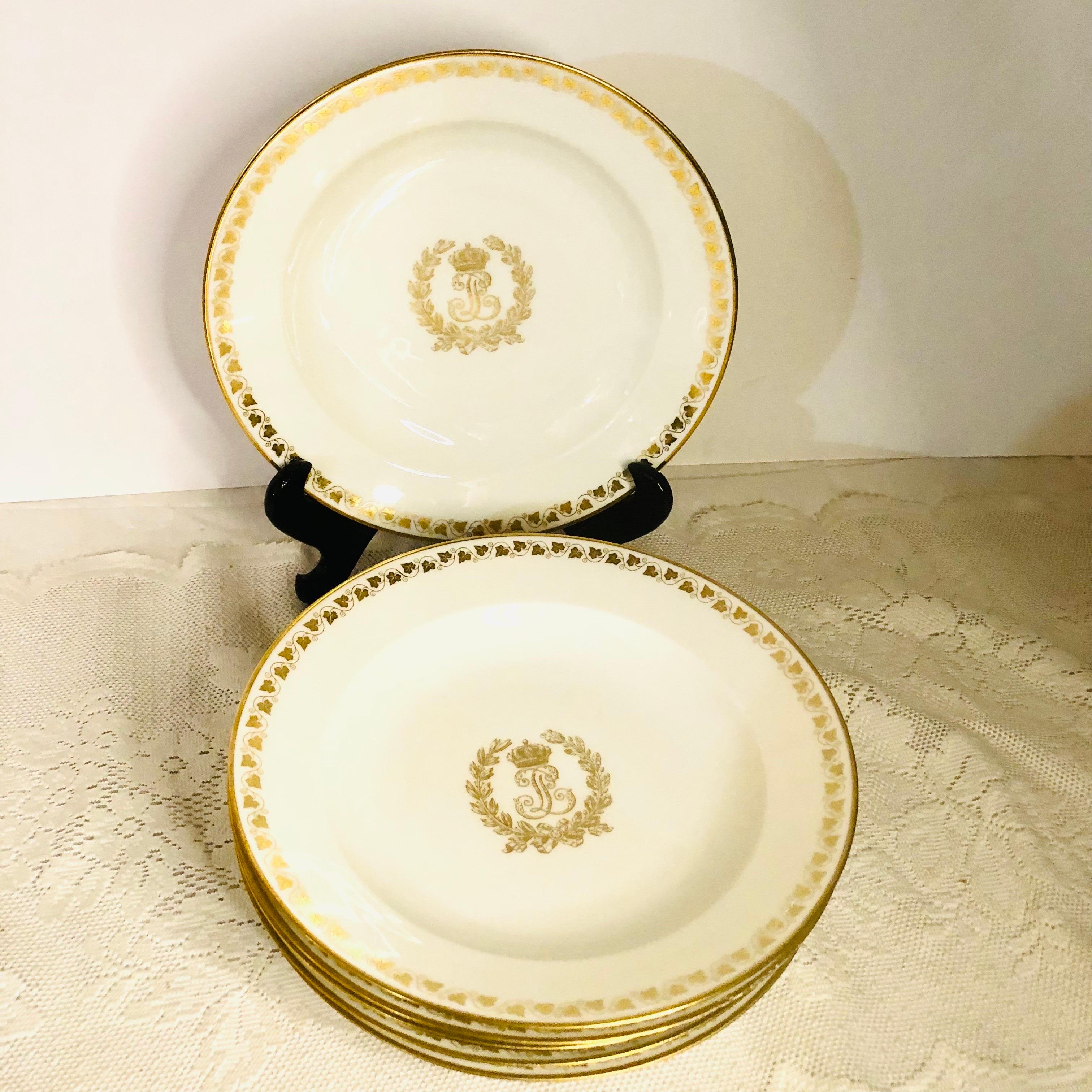 This is a rare set of six Sevres wide rim soup bowls with white ground having an elegant central gold monogram for King Louis Philippe. The gold monogram for King Louis Phillippe is surrounded by a gold foliate leaf wreath. Above the monogram is a
