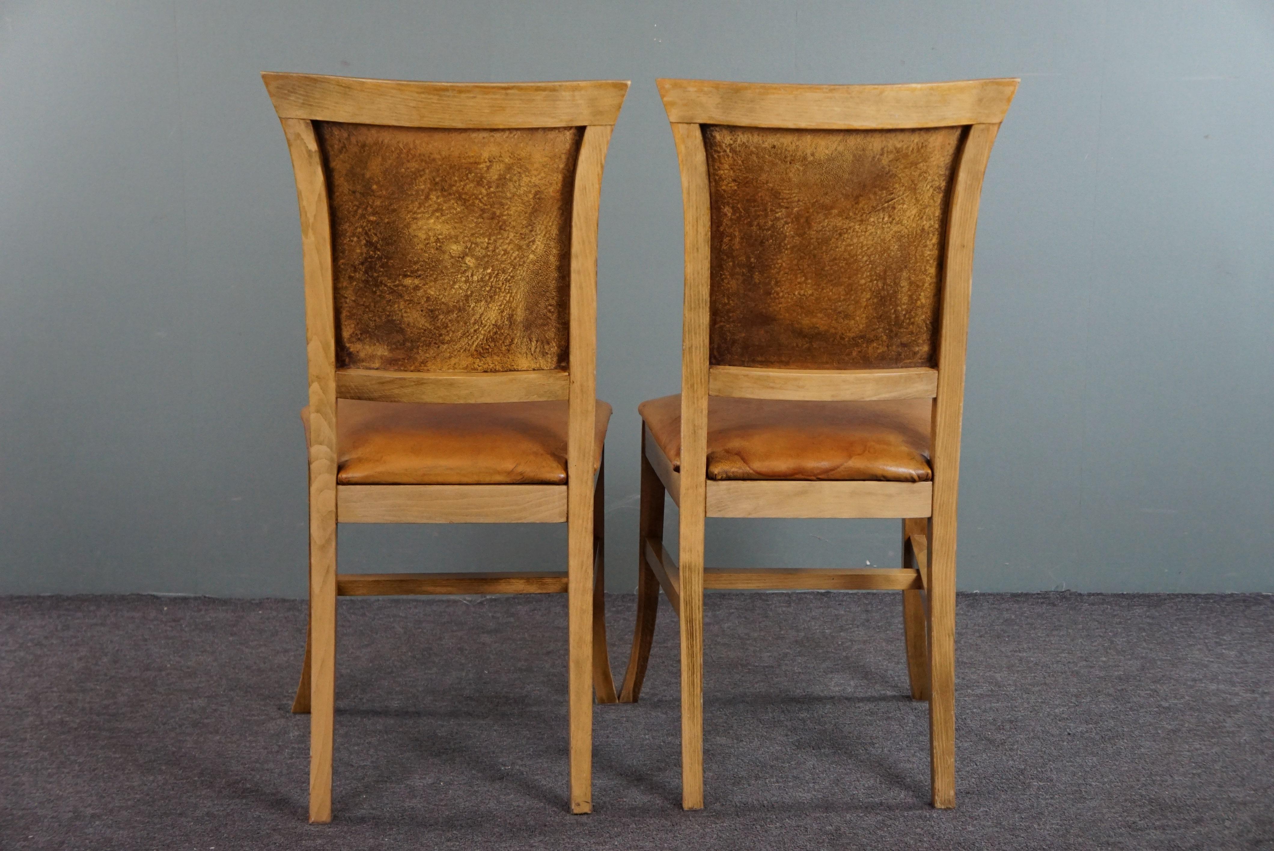 Set of six sheep leather dining chairs with a light wooden frame In Fair Condition For Sale In Harderwijk, NL