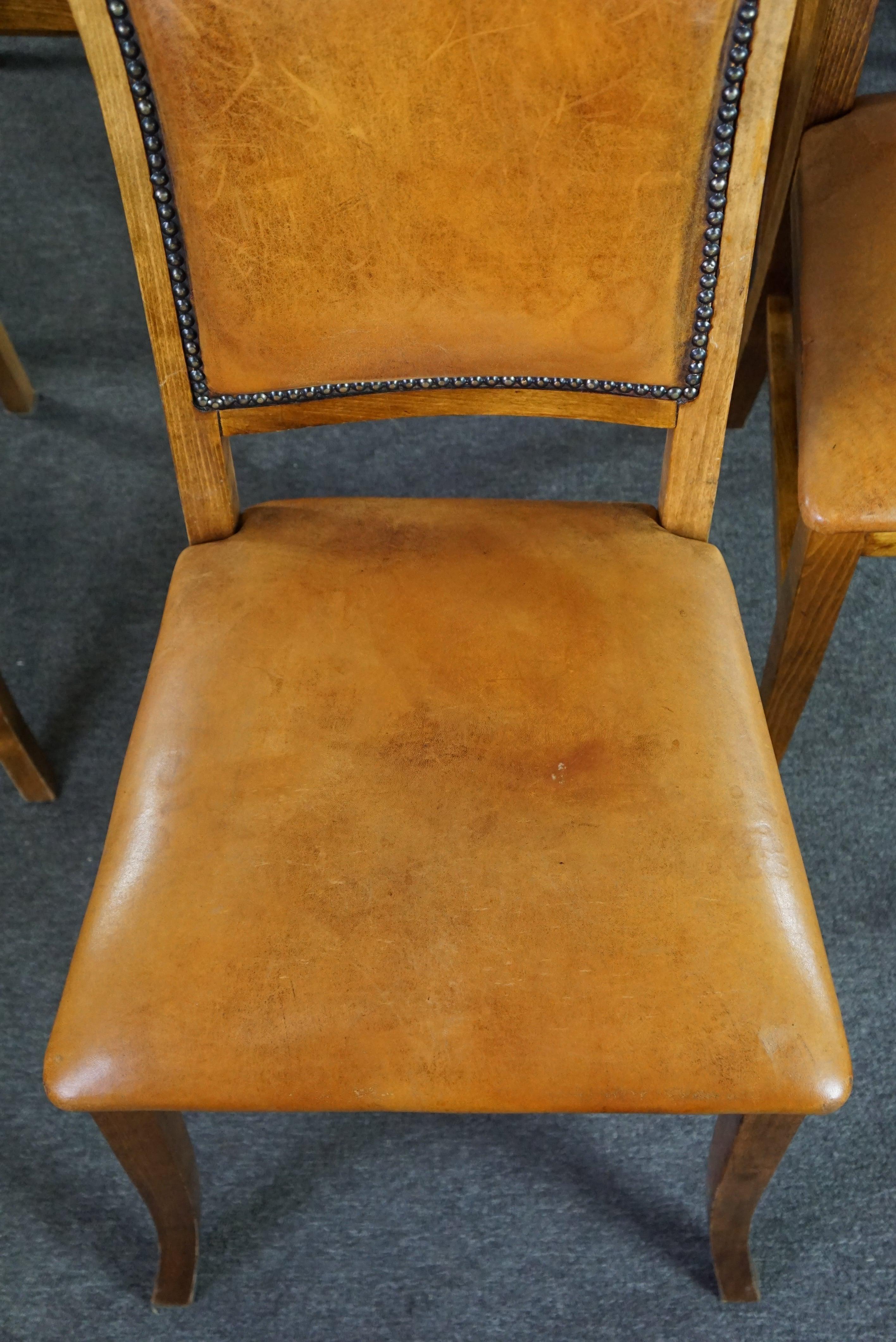 Leather Set of six sheep leather dining chairs with a light wooden frame For Sale