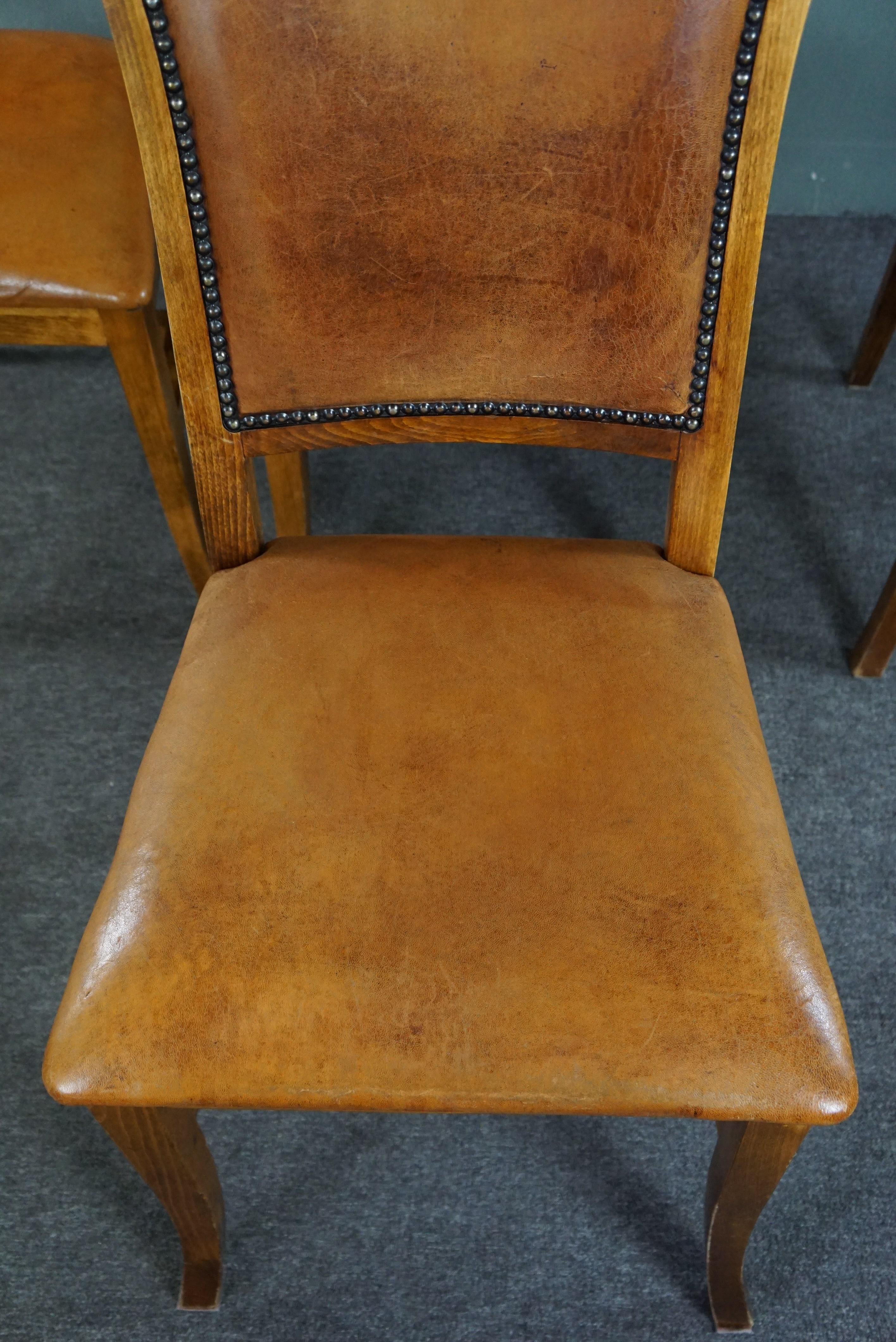 Set of six sheep leather dining chairs with a light wooden frame For Sale 2