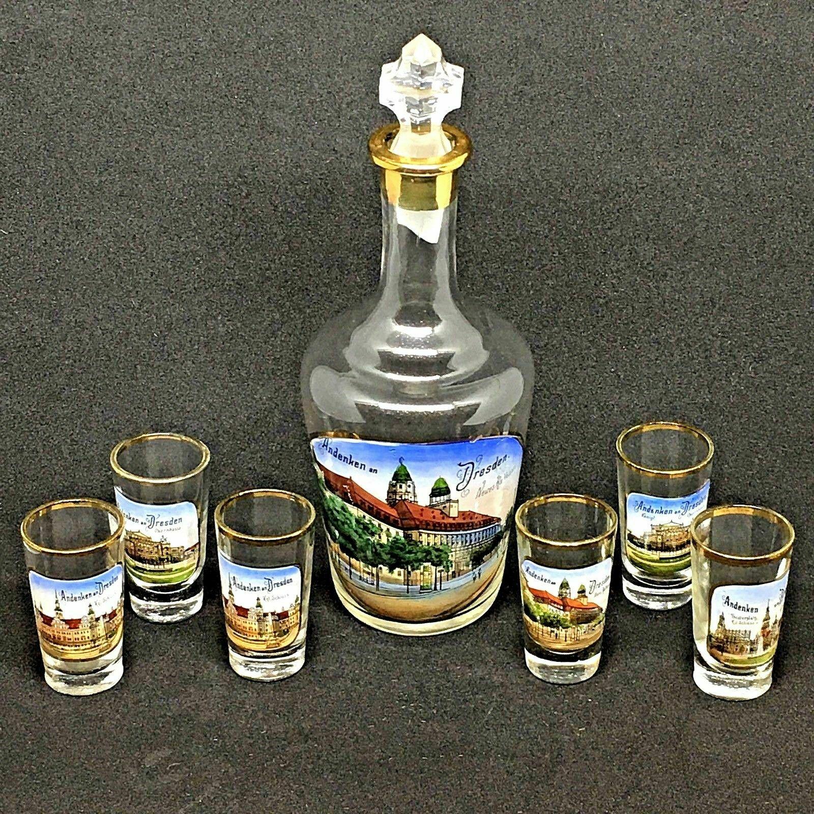 Set of six beautiful glasses with pictures of Dresden and a decanter. Very good vintage condition, consistent with age and use. Decanter is approx. 7 3/4