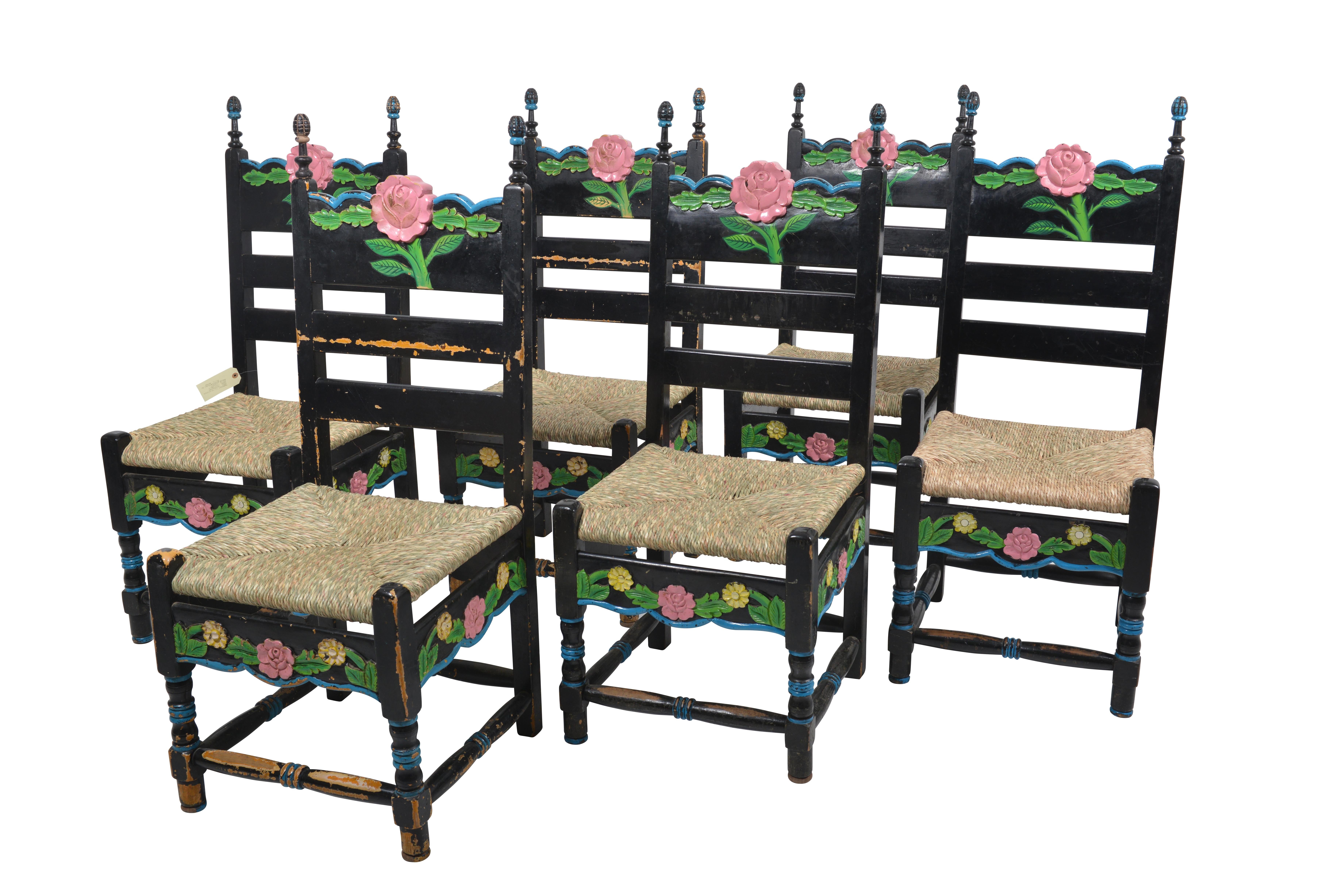 Set of six Sicilian painted rustic chairs.
Most charming set of Sicilian country chairs. Made in the local Classic style with rush seats, they are extremely comfortable. Really cool, fun and elegant is the polychromy on the chairs, black lacquer