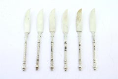 Set of six silver butter knives