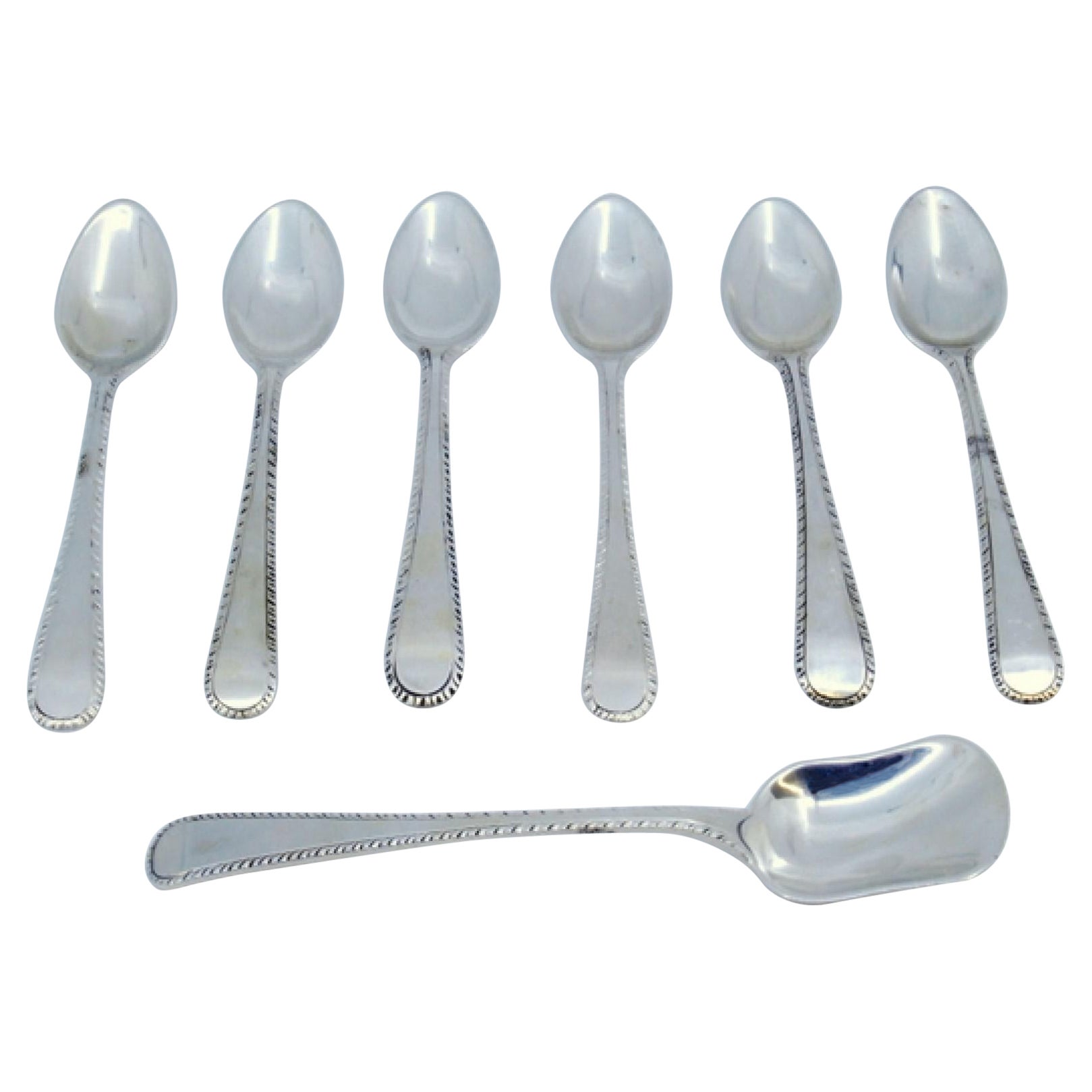 Set of six silver coffee spoons and sugar shovel with crimped handles