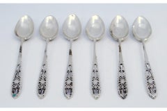 Set of six silver coffee spoons with filigree-cut handles