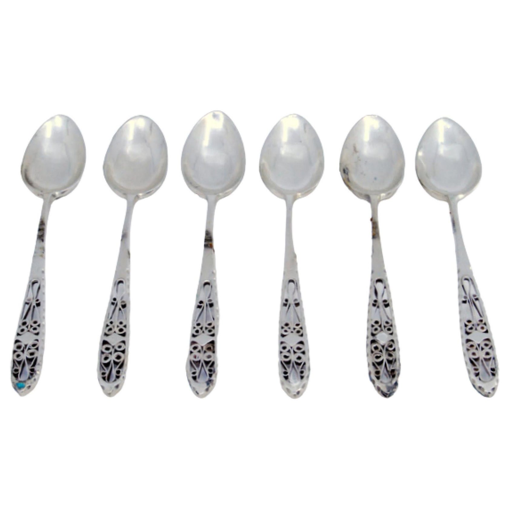 Set of six silver coffee spoons with filigree-cut handles
