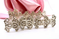 Set of six silver cutlery holders with "BDC" cut-out reliefs