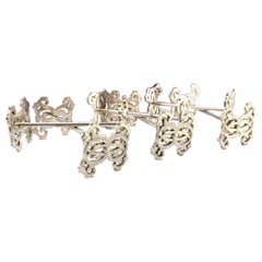 Set of six silver cutlery holders with "BDC" cut-out reliefs