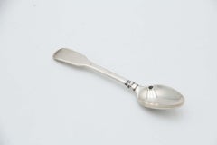 Set of six silver dessert spoons